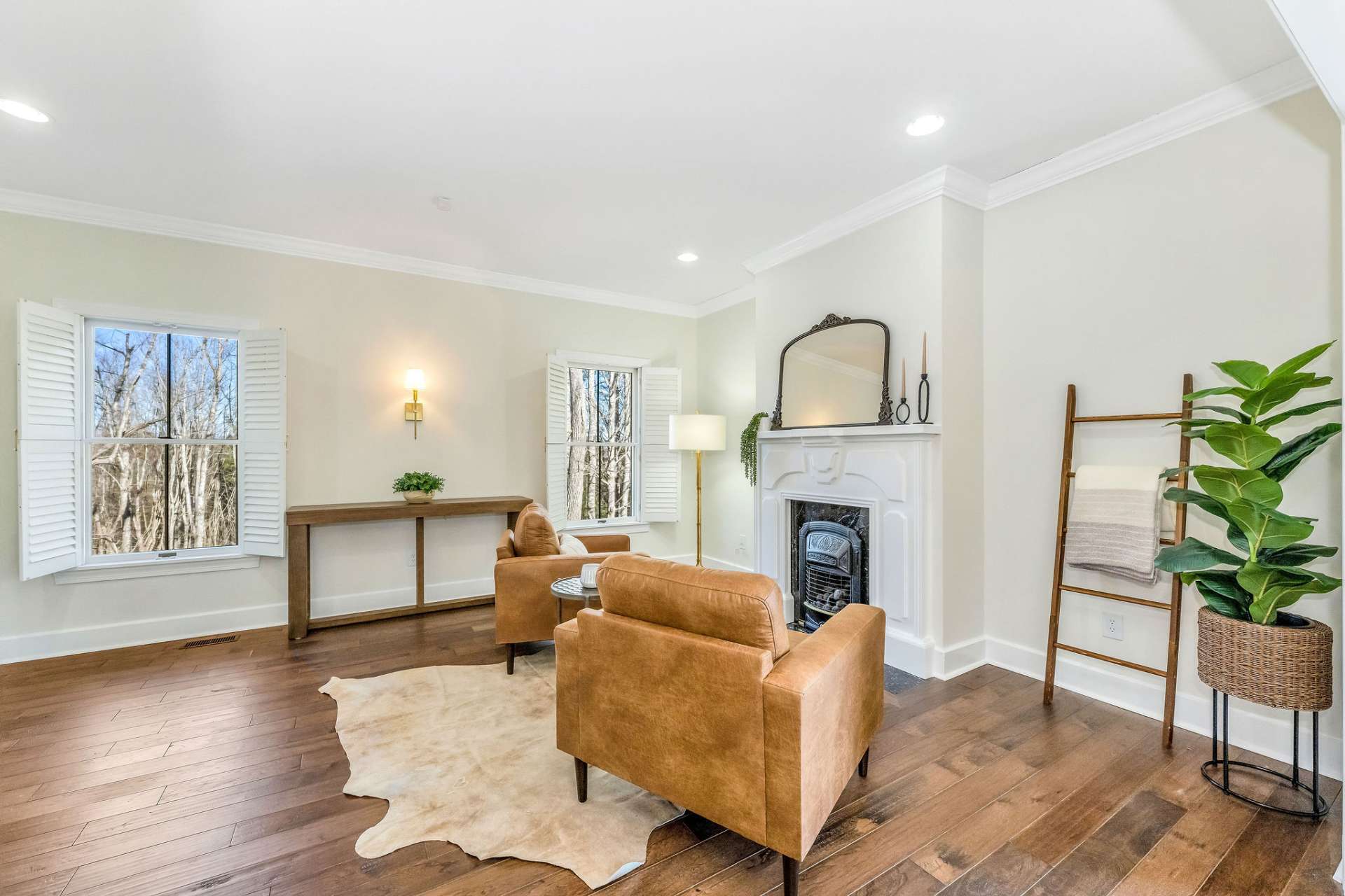 A second fireplace with a propane stove insert adds a cozy vibe to sitting room.