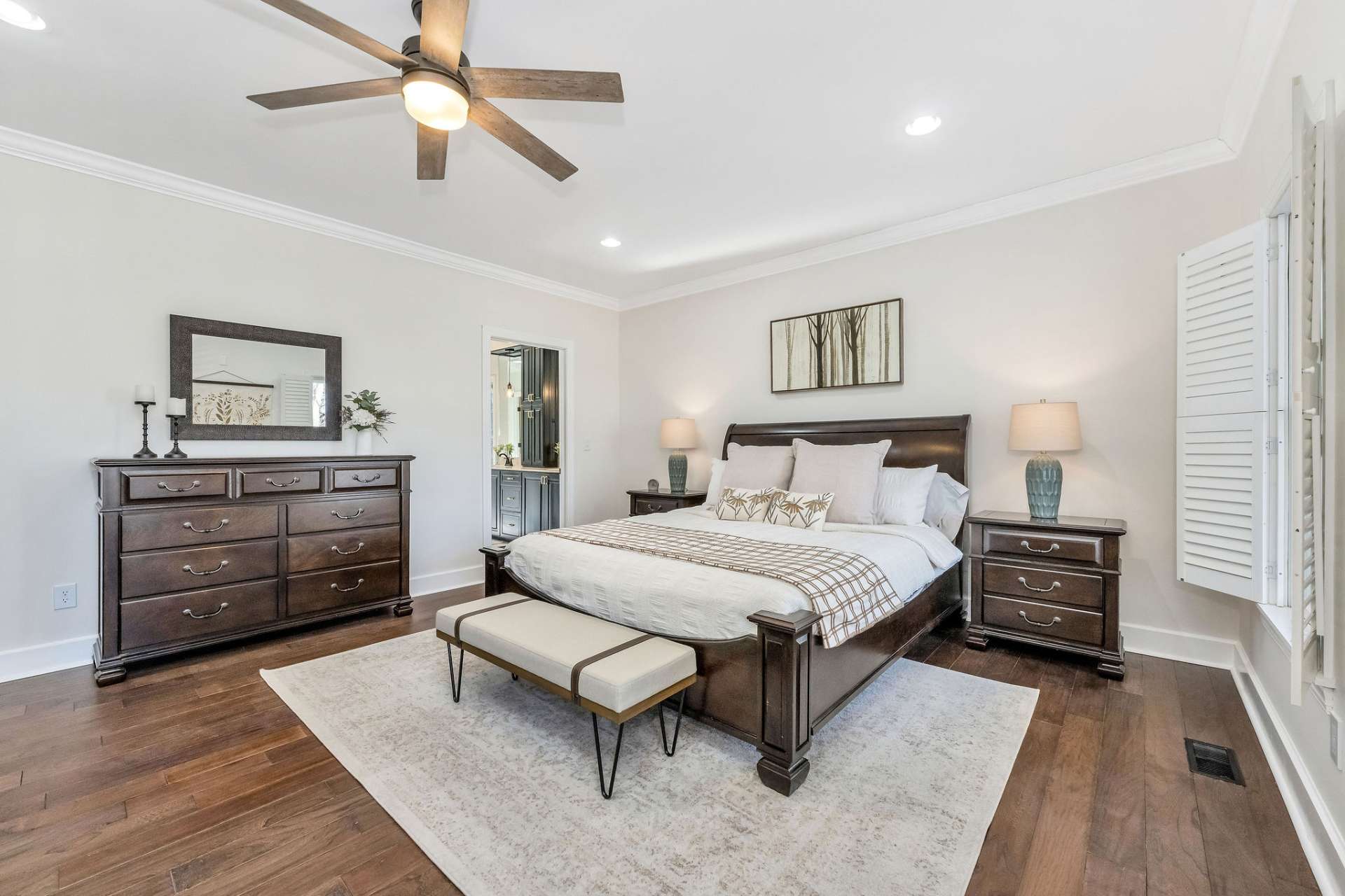 A spacious main level primary suite is designed to relax and unwind.