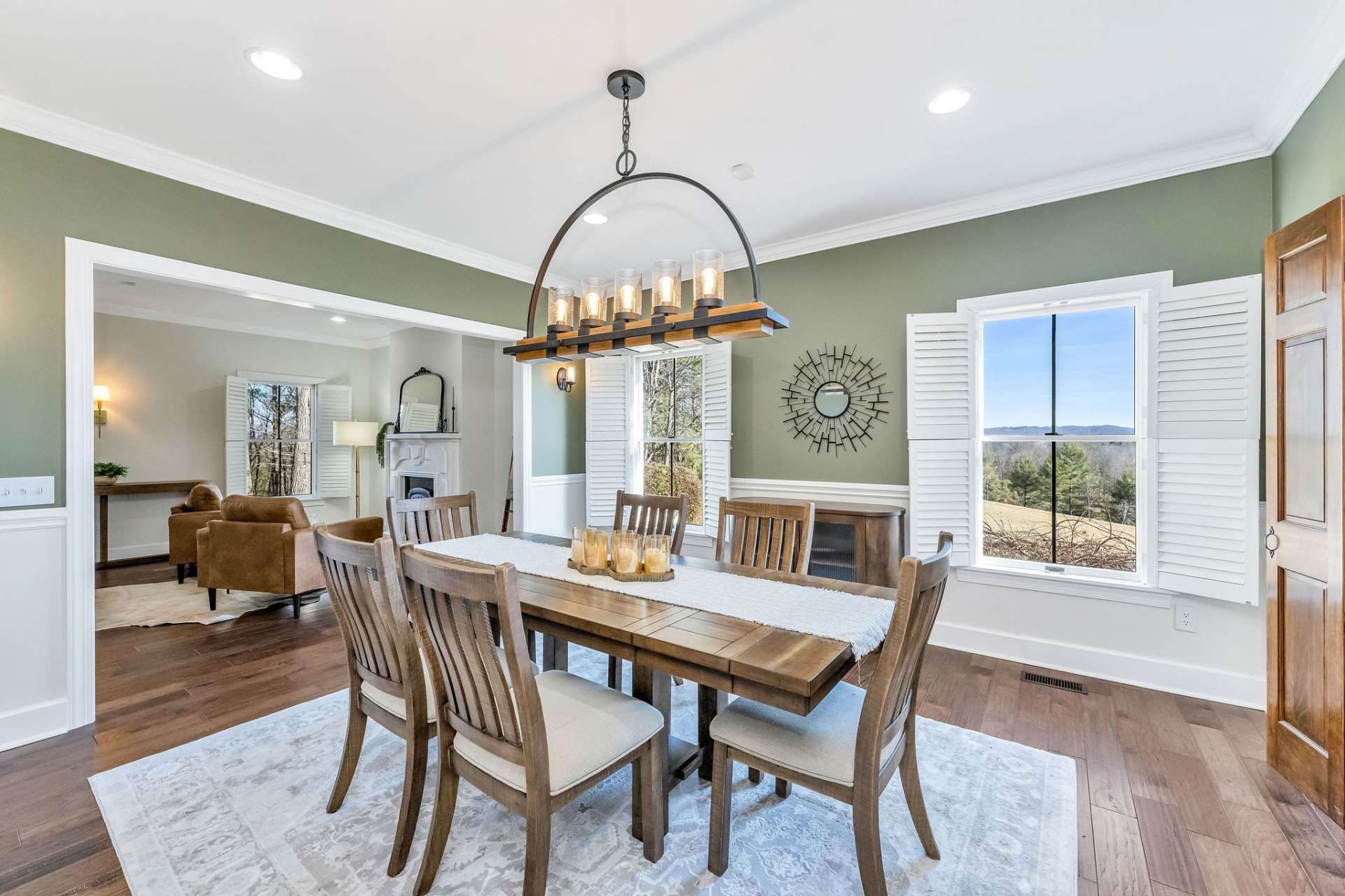 Throughout the home, expansive windows draw in natural light and frame the surrounding mountain landscape.