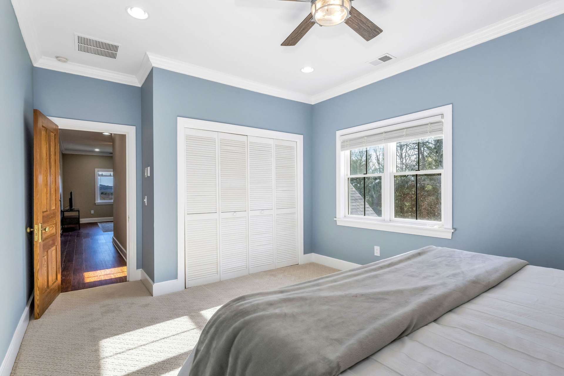 The 2 upper-level private bedrooms feature new carpet.