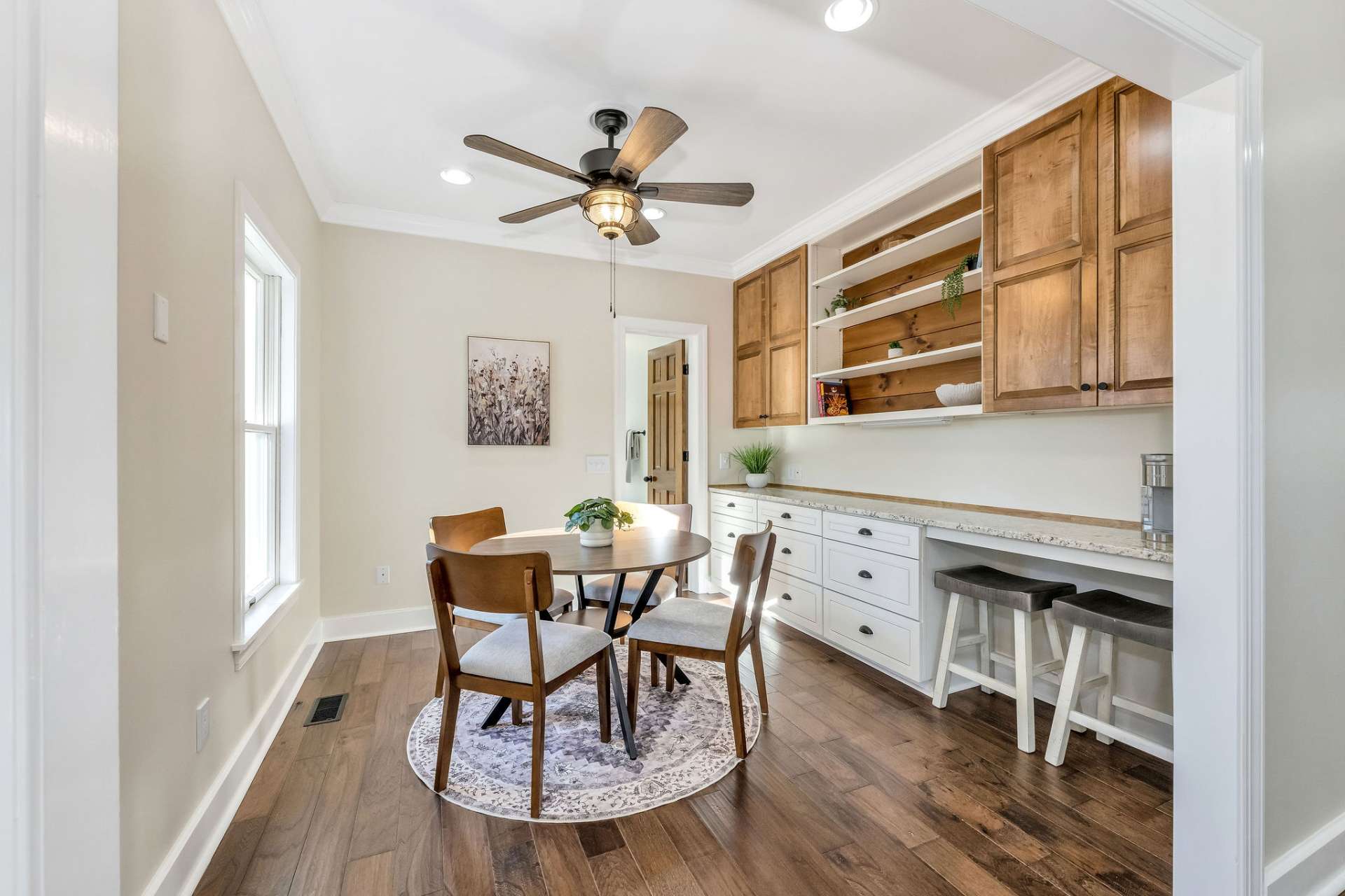 A welcoming informal dining area with additional storage for kitchen appliances.