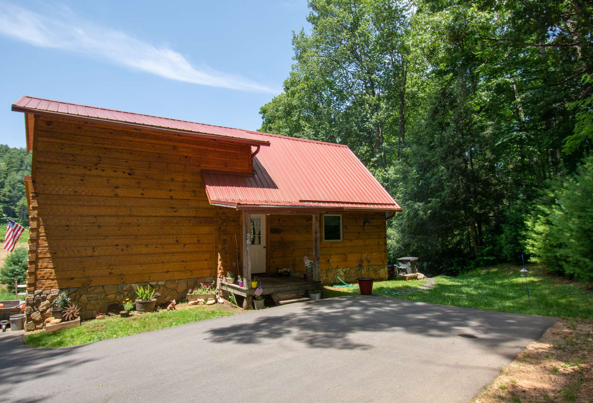 This 2-bedroom, plus bonus room, 3-bath log cabin welcomes you to experience mountain log cabin living with river frontage to enjoy kayaking, tubing, fishing, and exploring the New River.