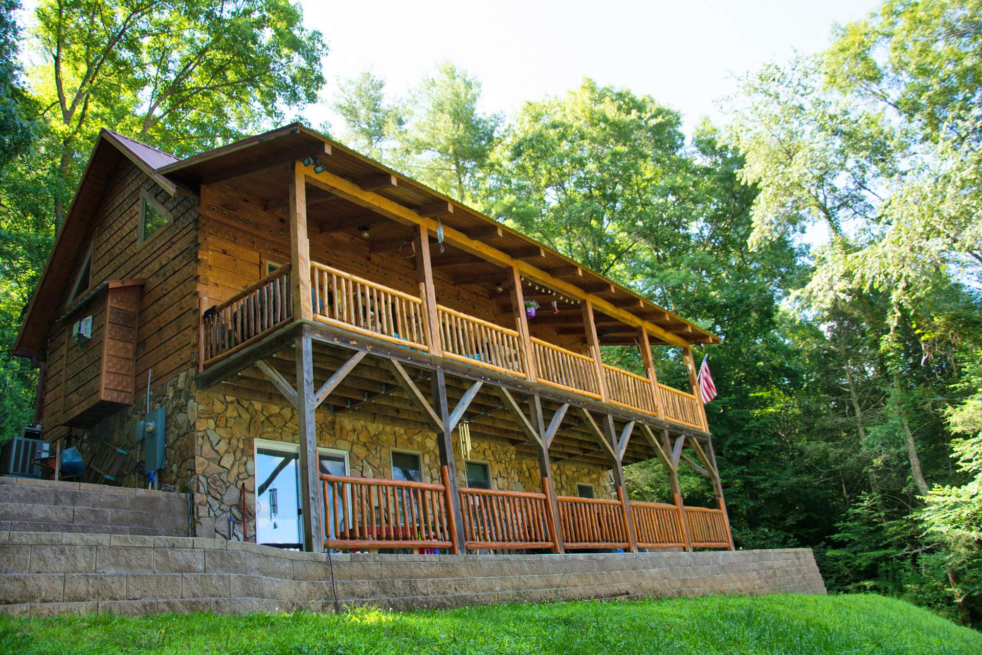 This cabin features two levels of covered decking to enjoy the river views and outdoor entertaining.