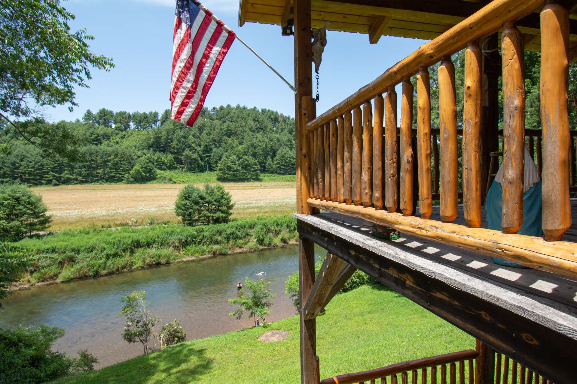 This is your chance to purchase a quality built log cabin on the banks of the New River off of Phillips Gap Road convenient to West Jefferson and the surrounding High Country.