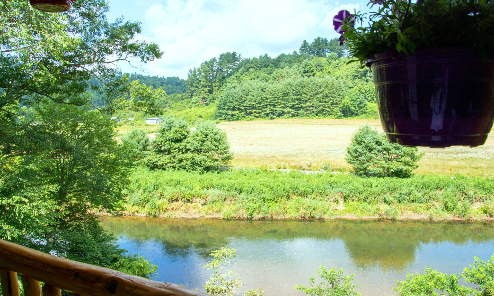 RIVER FRONTAGE, VIEW & PRIVACY with this custom-built NC Mountain LOG CABIN being sold FURNISHED!