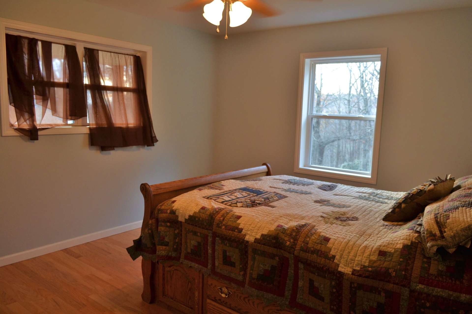 This is the larger of the two bedrooms and features lots of windows to enjoy the views and mountain scenery.