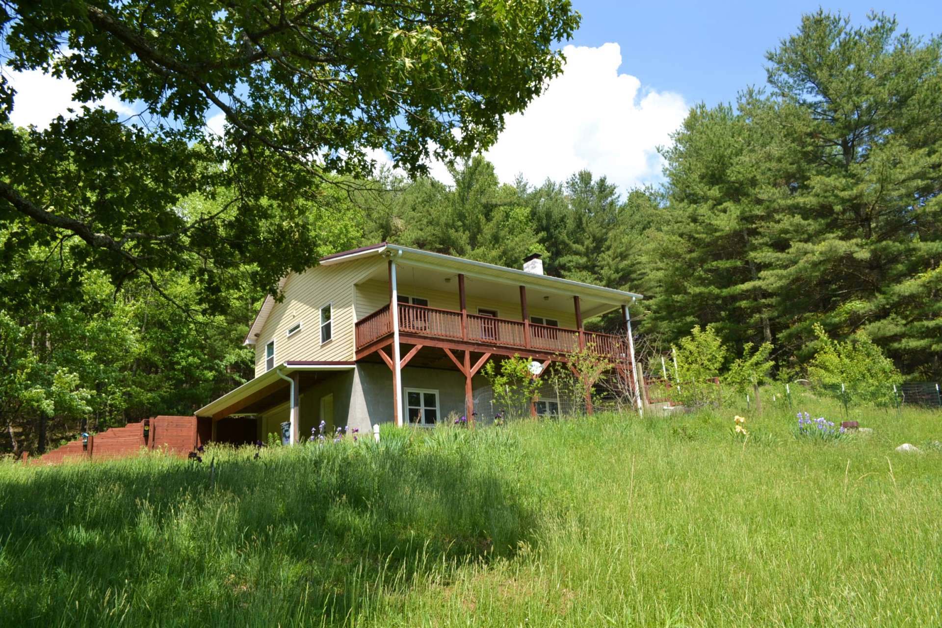 The setting allows for plenty of space for gardening and play.  There is enough grassland for a horse or other livestock.