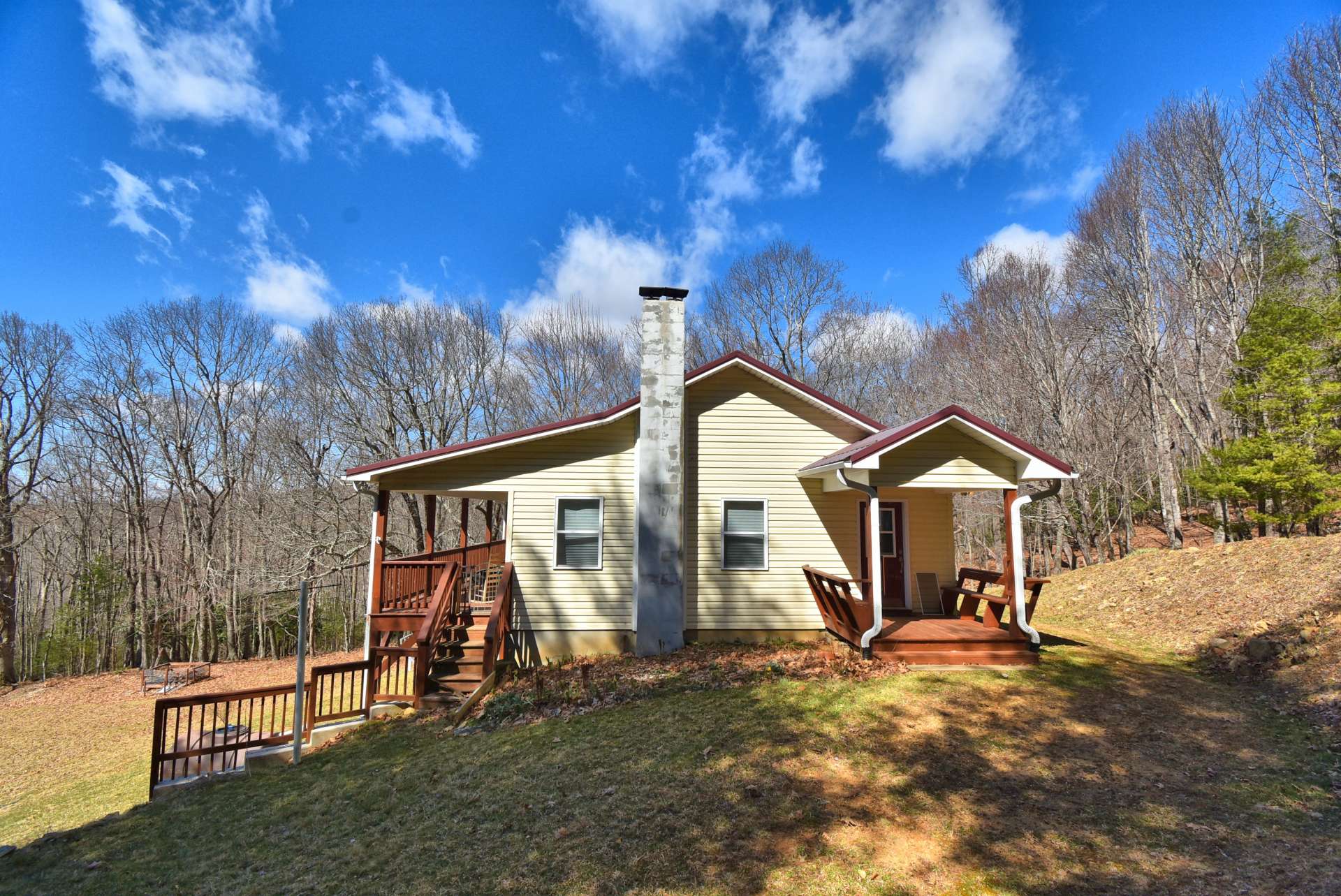 A sweet covered side porch welcomes you home.