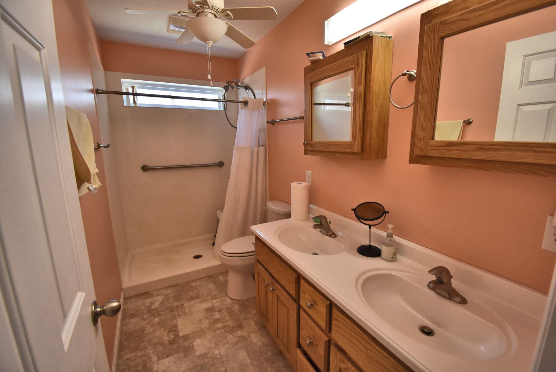 The main level bath offers a double vanity and walk-in shower.