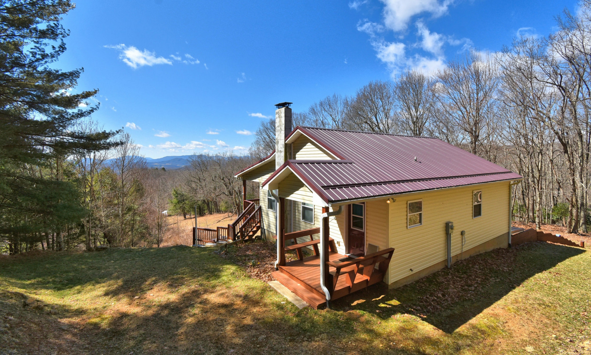 Enjoy Private mountain living and fabulous long range layered views with this sweet 2-bedroom, 2-bath mountain cottage nestled among 6.95 acres in Kindrick Mountain, a private gated community in the Mouth of Wilson area of Grayson County of Southwest Virginia.