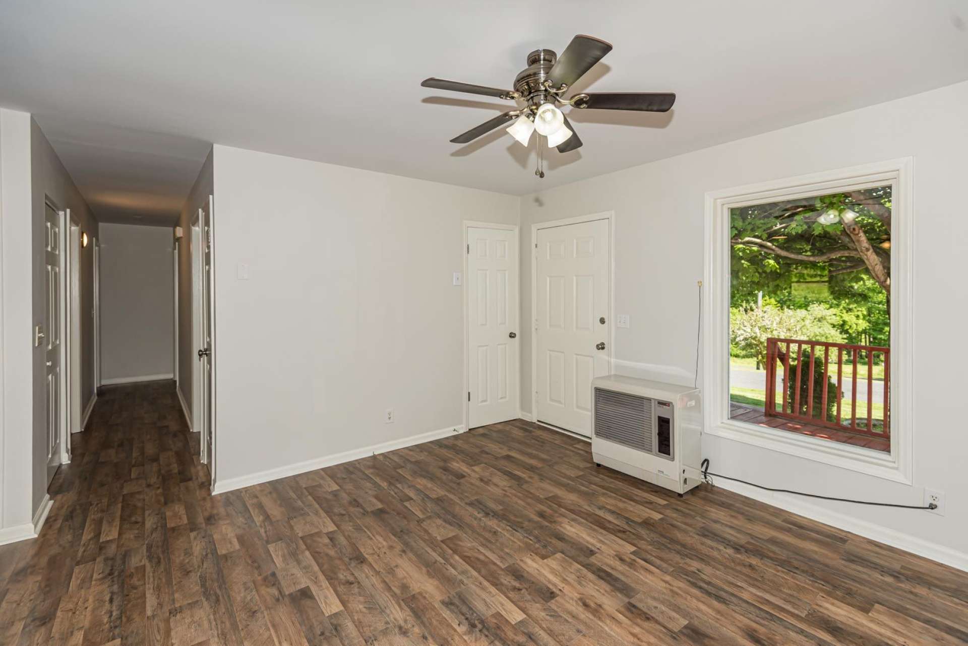 All new  floor covering, new paint,  tile and light fixtures throughout make this country home feel brand new. Notice the large window in the living area filling the home with natural light.
