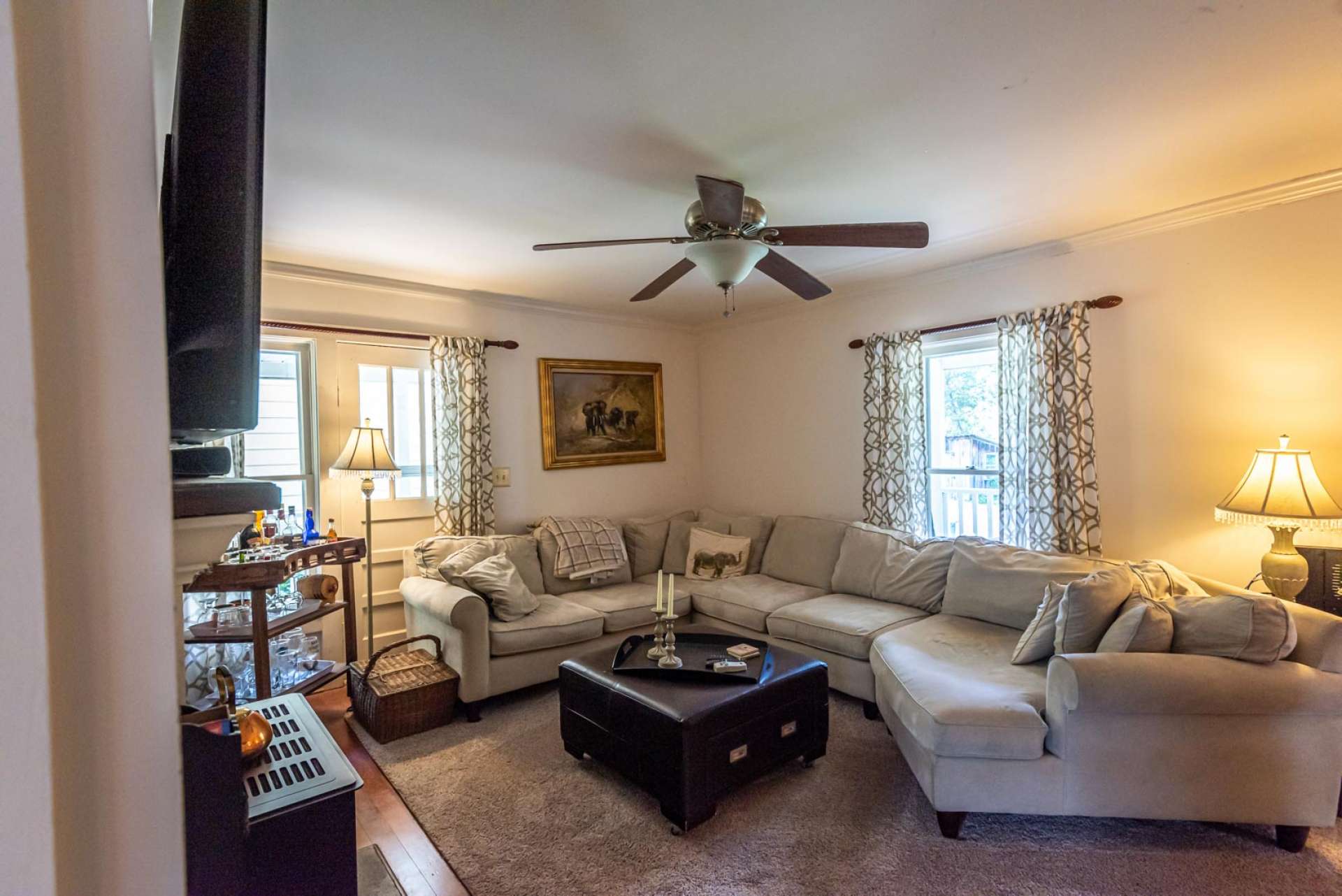 Another view of the living room. There is a door to the left, the current owners do not use it.