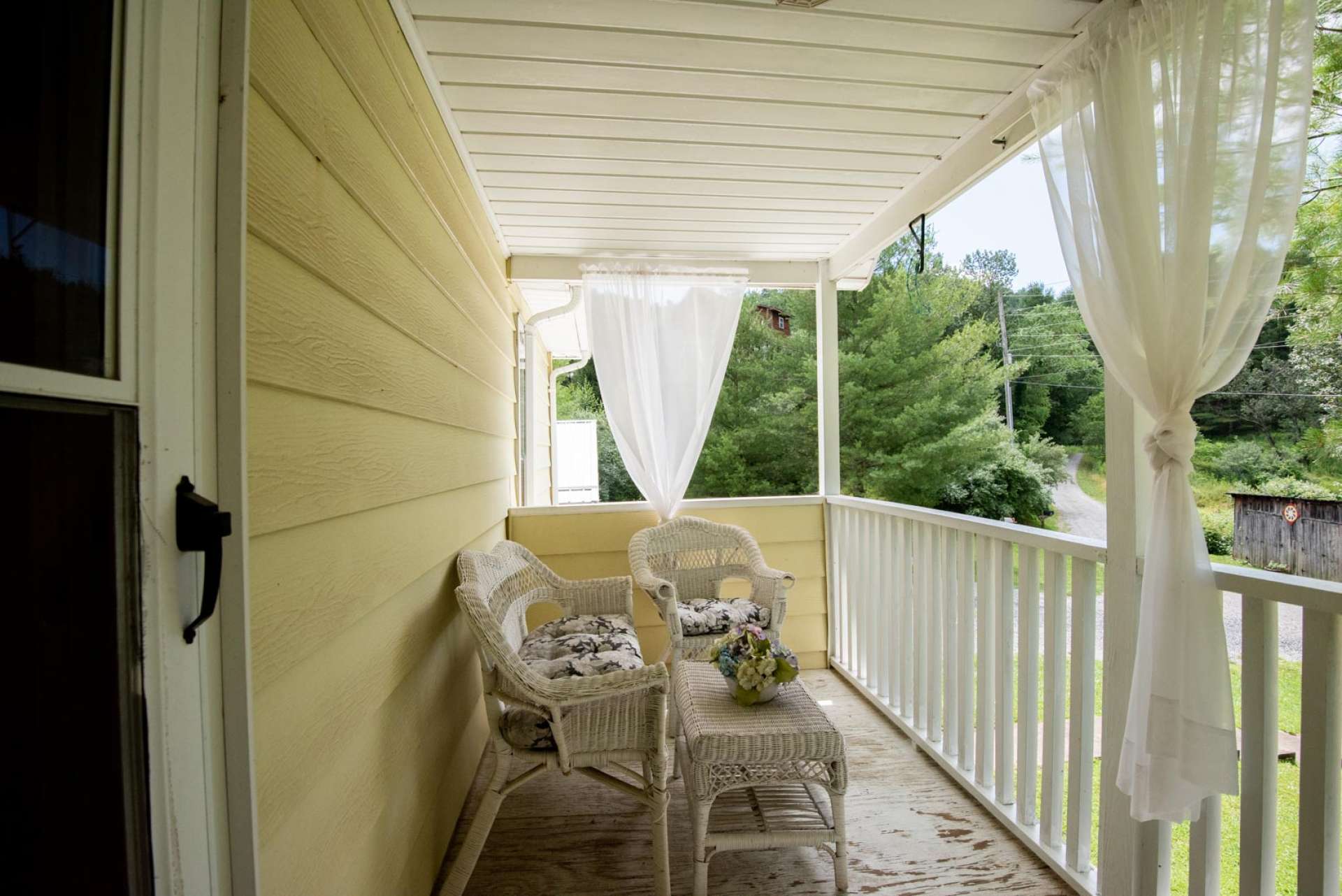 The upper level offers a great  private covered porch to enjoy the fresh mountain air.