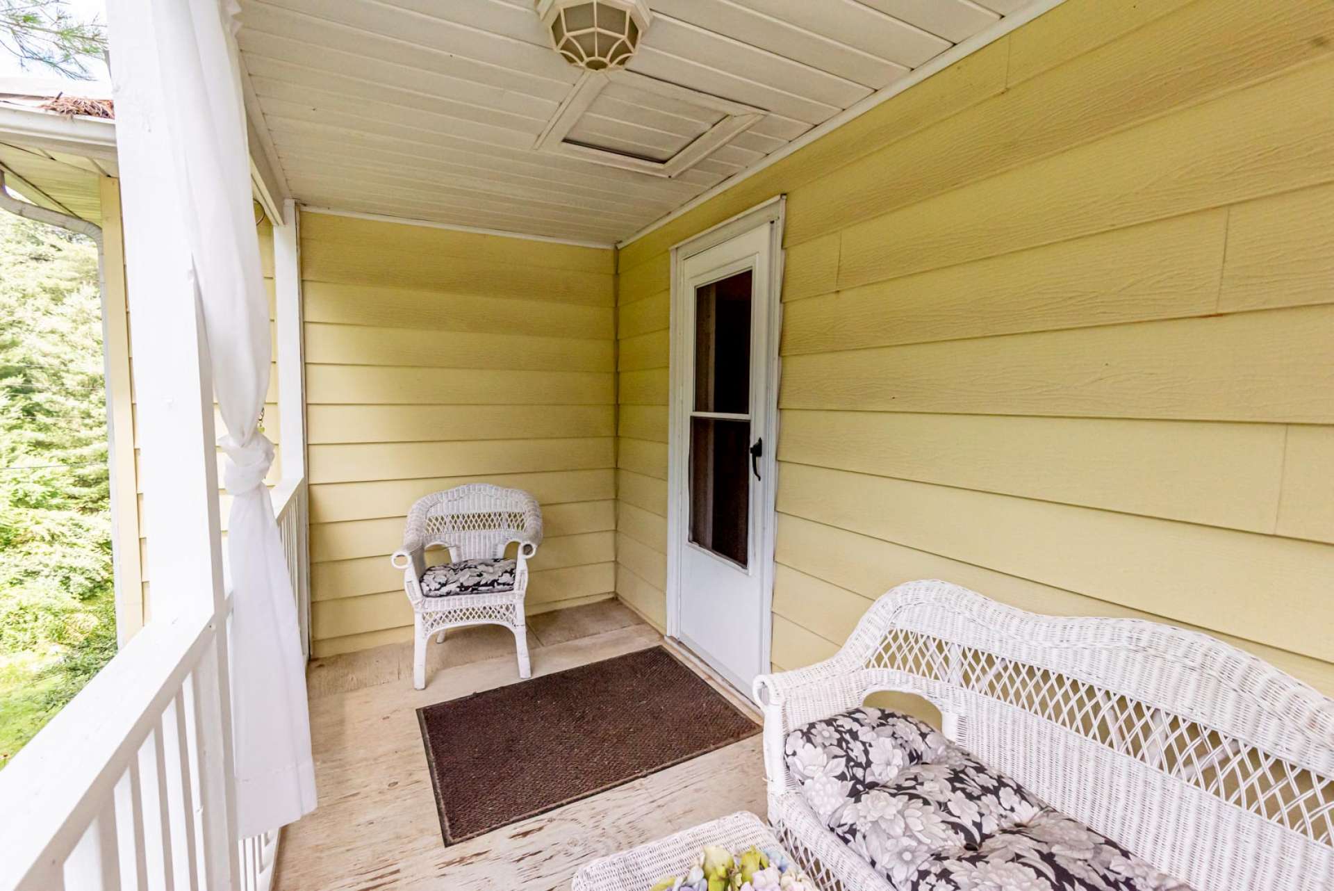 A welcoming front porch invites you to sit for a while and enjoy the fresh mountain air.