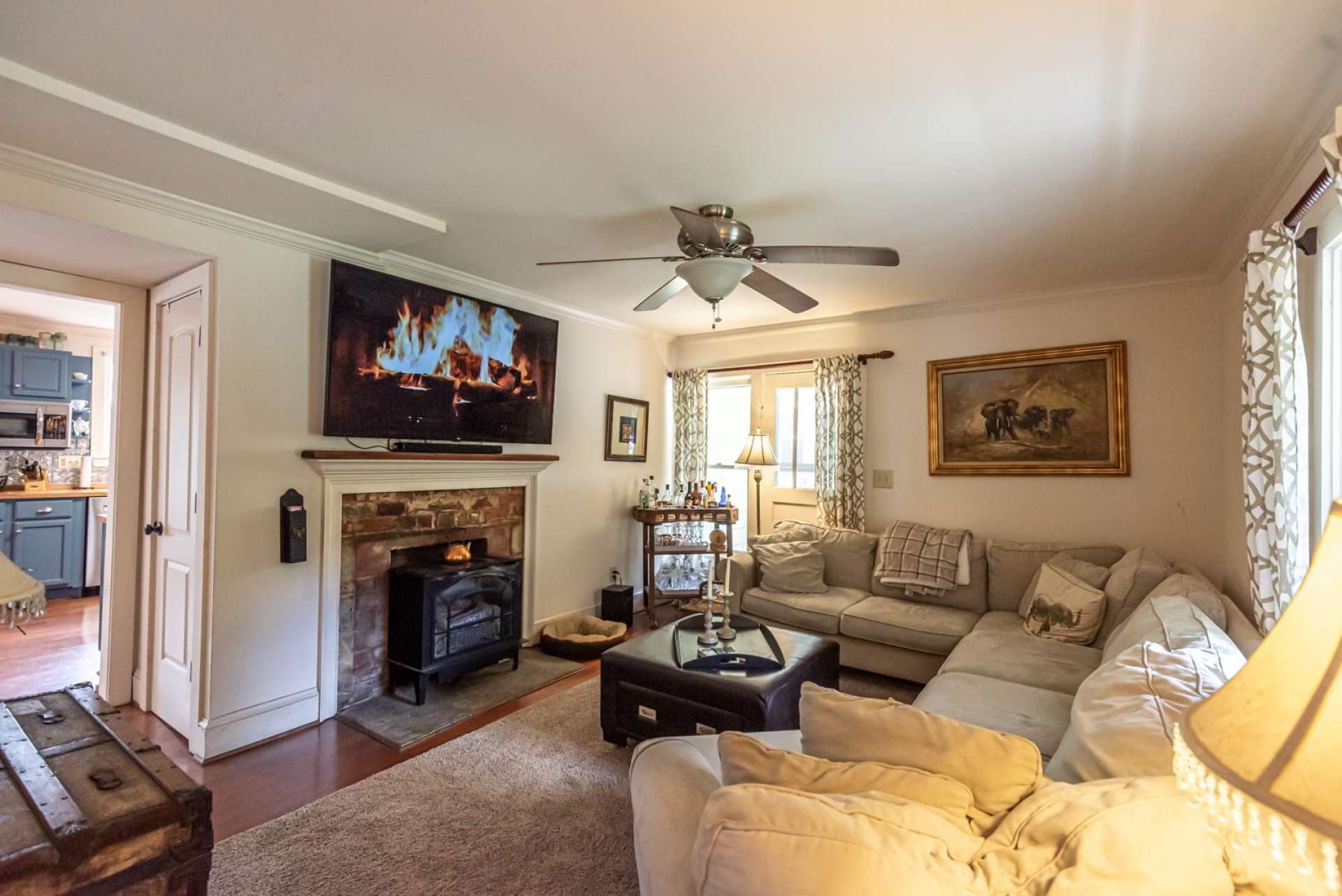 Cozy living room space features a gas stove