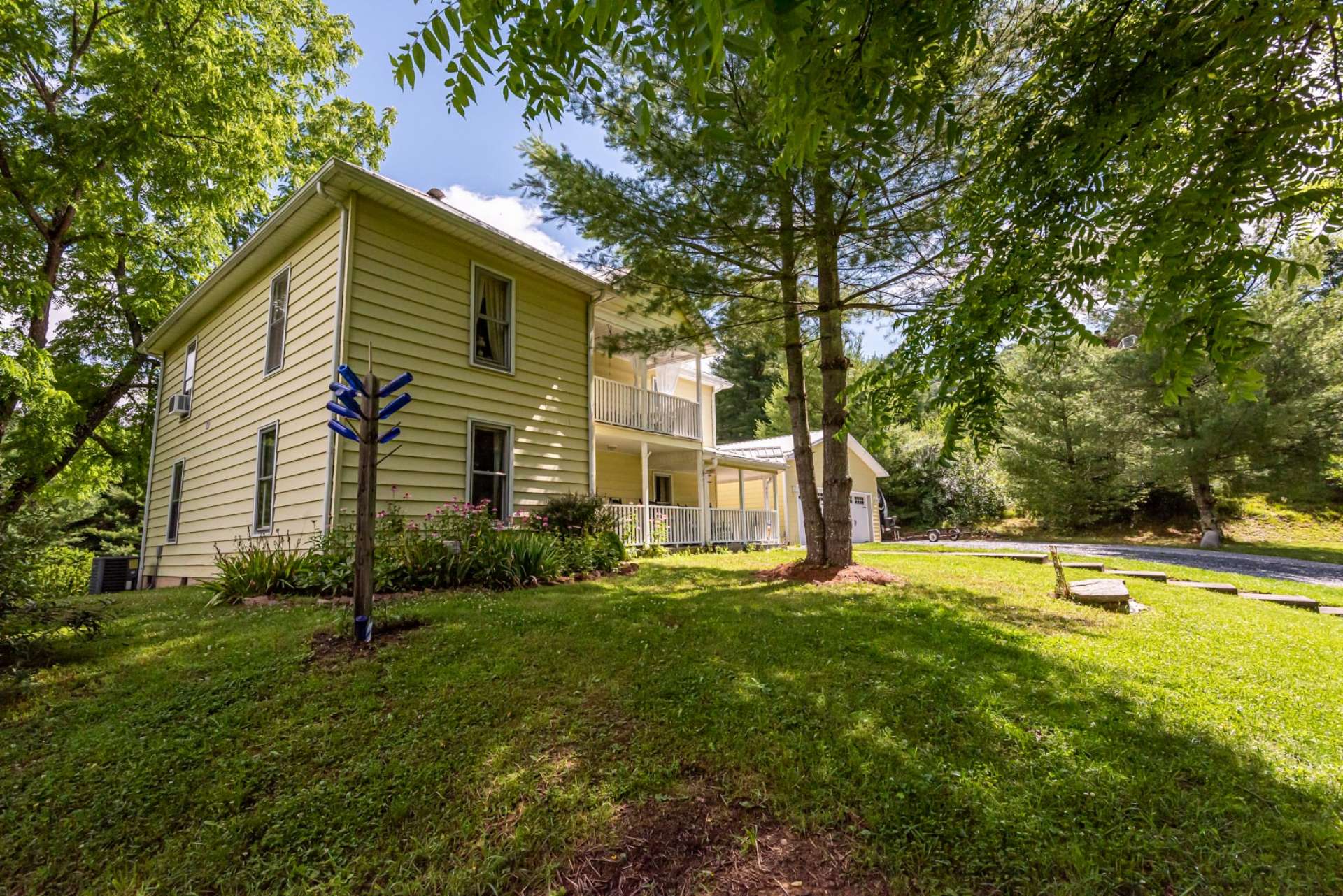 Another front view of the home reveals the lovingly landscaped yard.