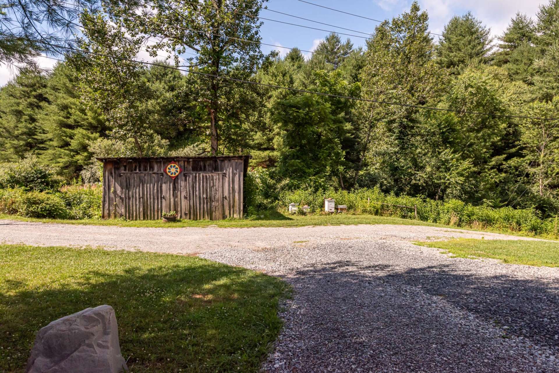 This outbuilding can be utilized for storage of lawn and garden equipment or barn.