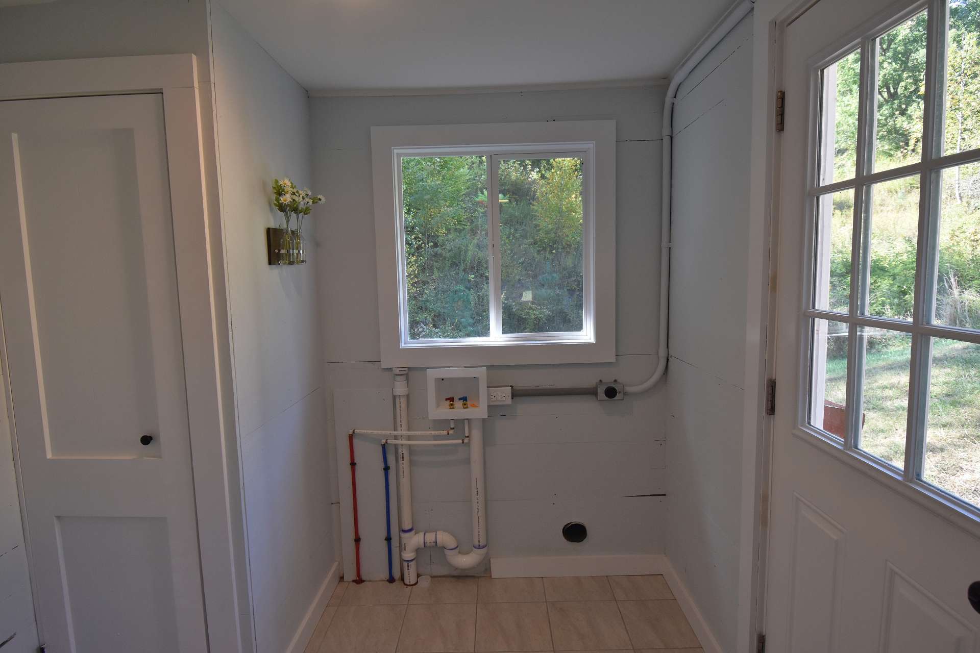 A laundry room is accessed from the kitchen and completes the updated floor plan.