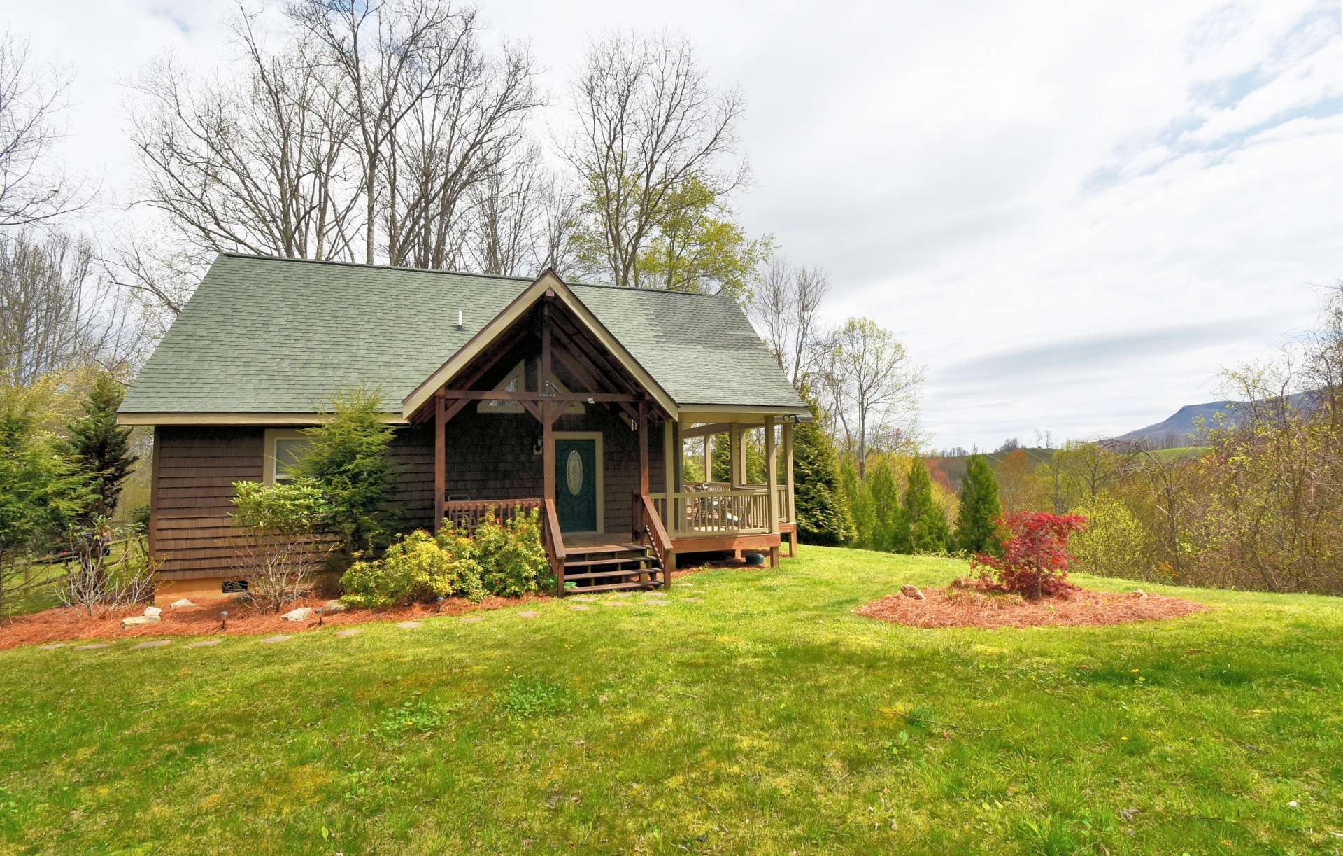 Offering a true log cabin  living experience, you will enjoy  modern conveniences, low maintenance exterior, and lovingly landscaped surroundings awaiting you here at this special place in the NC High Country.