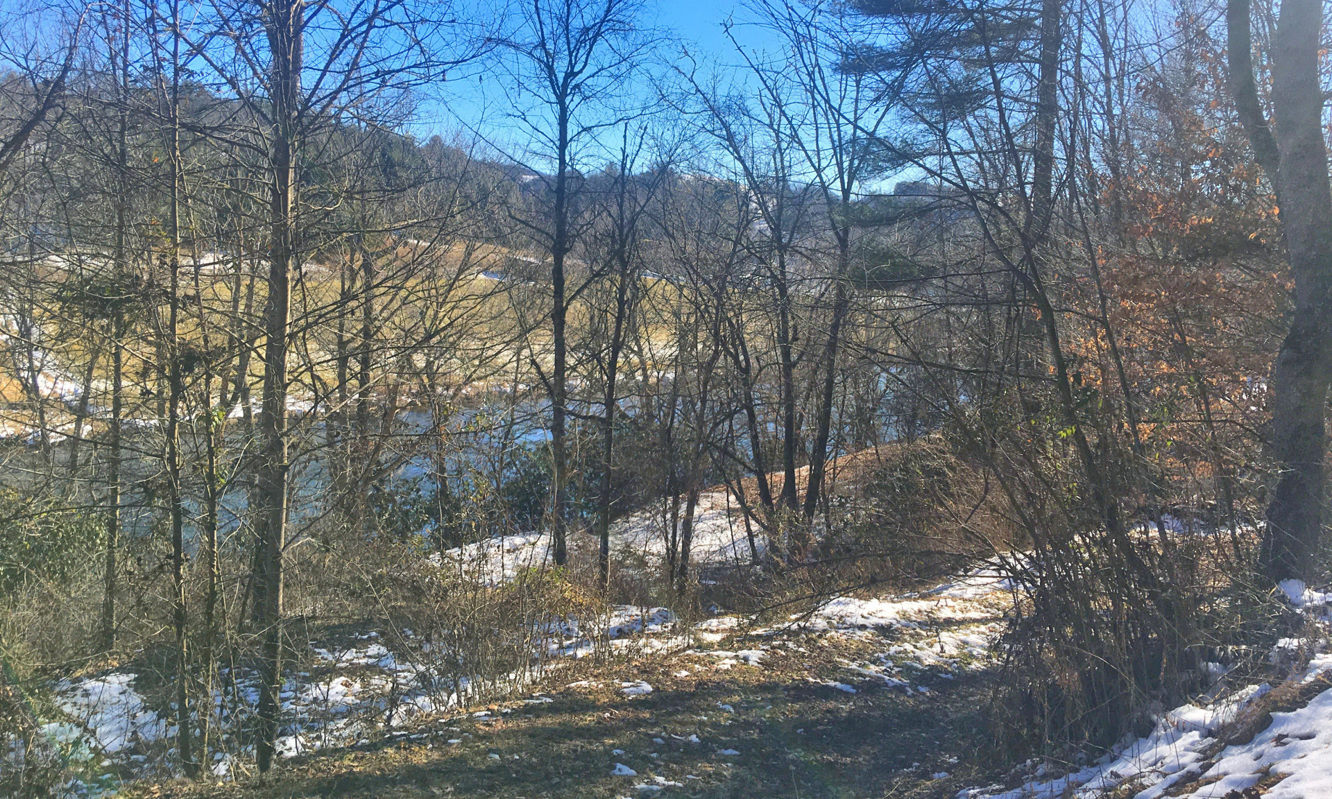 Imagine relaxing on the porch or deck of your newly constructed mountain cabin and enjoying these views of the New River.