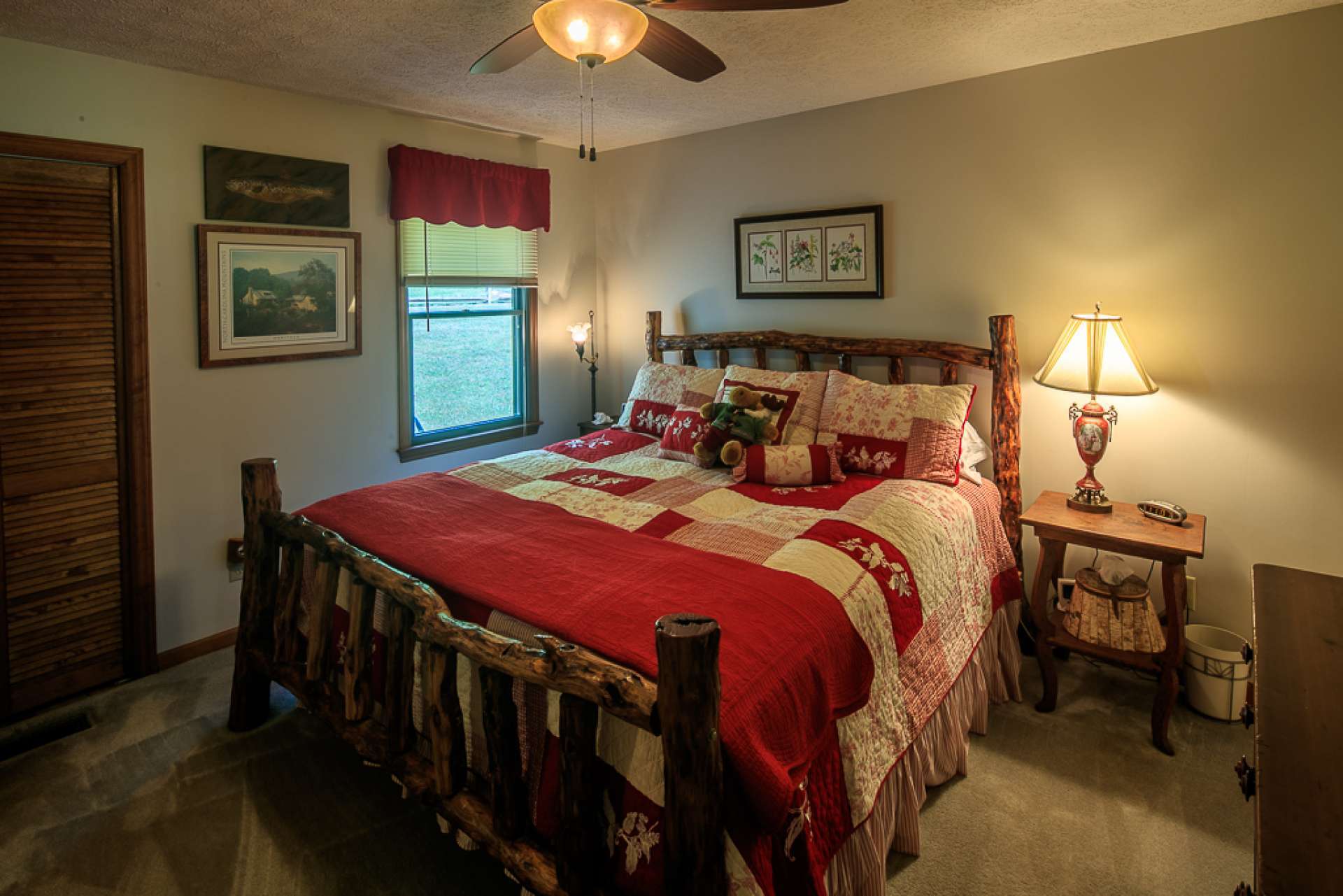 This main level master suite is spacious and features comfortable carpeted flooring.