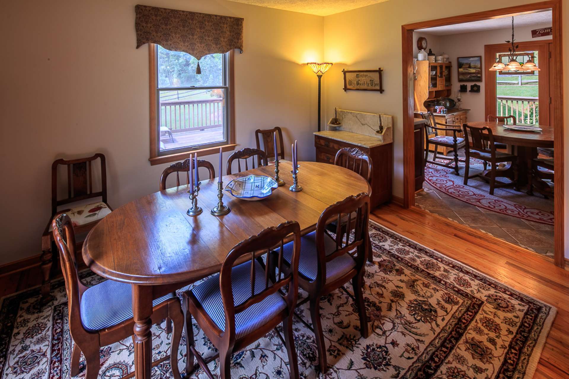 This formal dining space includes a sitting area for additional dinner guests or a quiet place to relax.