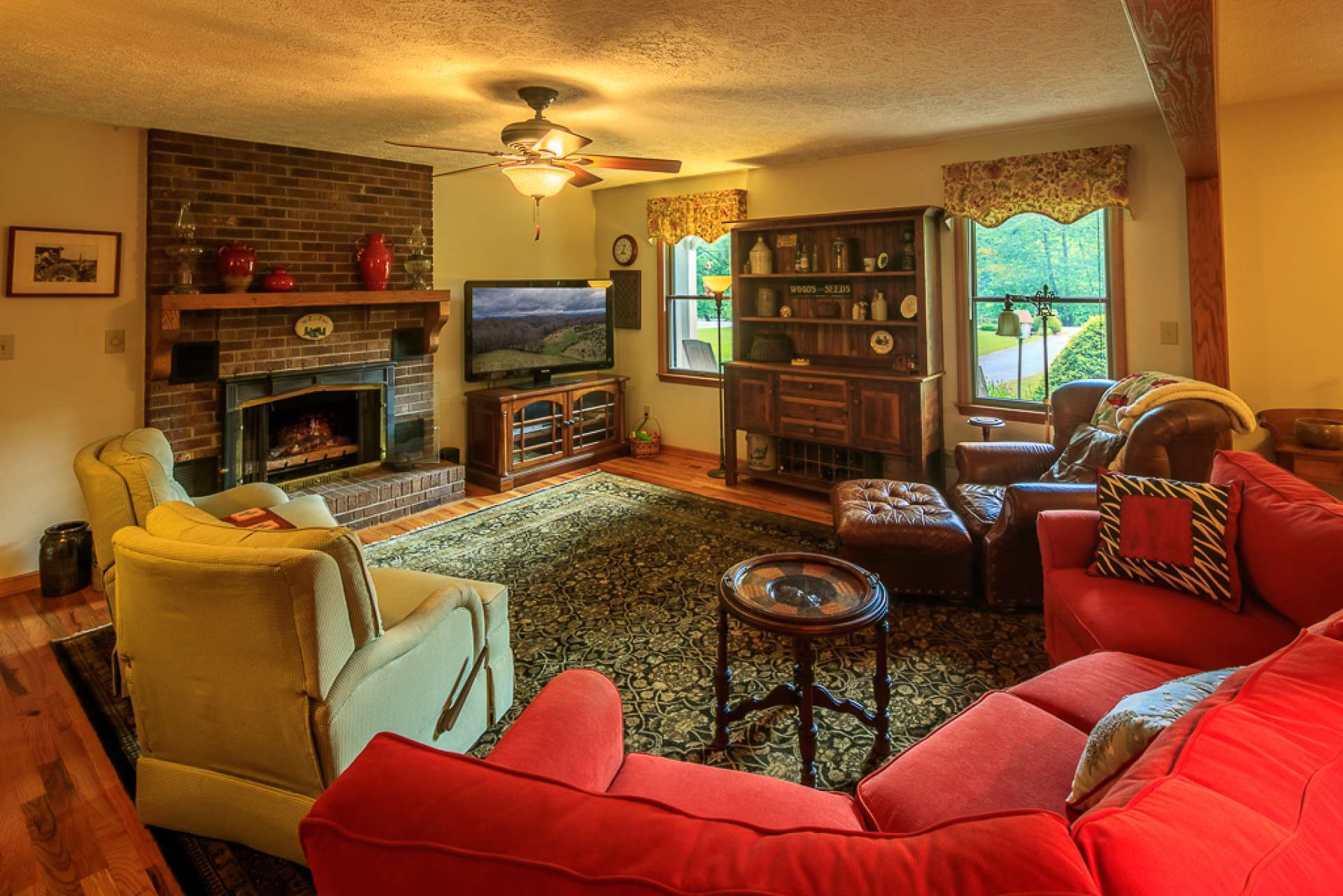 A spacious living room welcomes you and your guests to come in and experience country living in grand style.