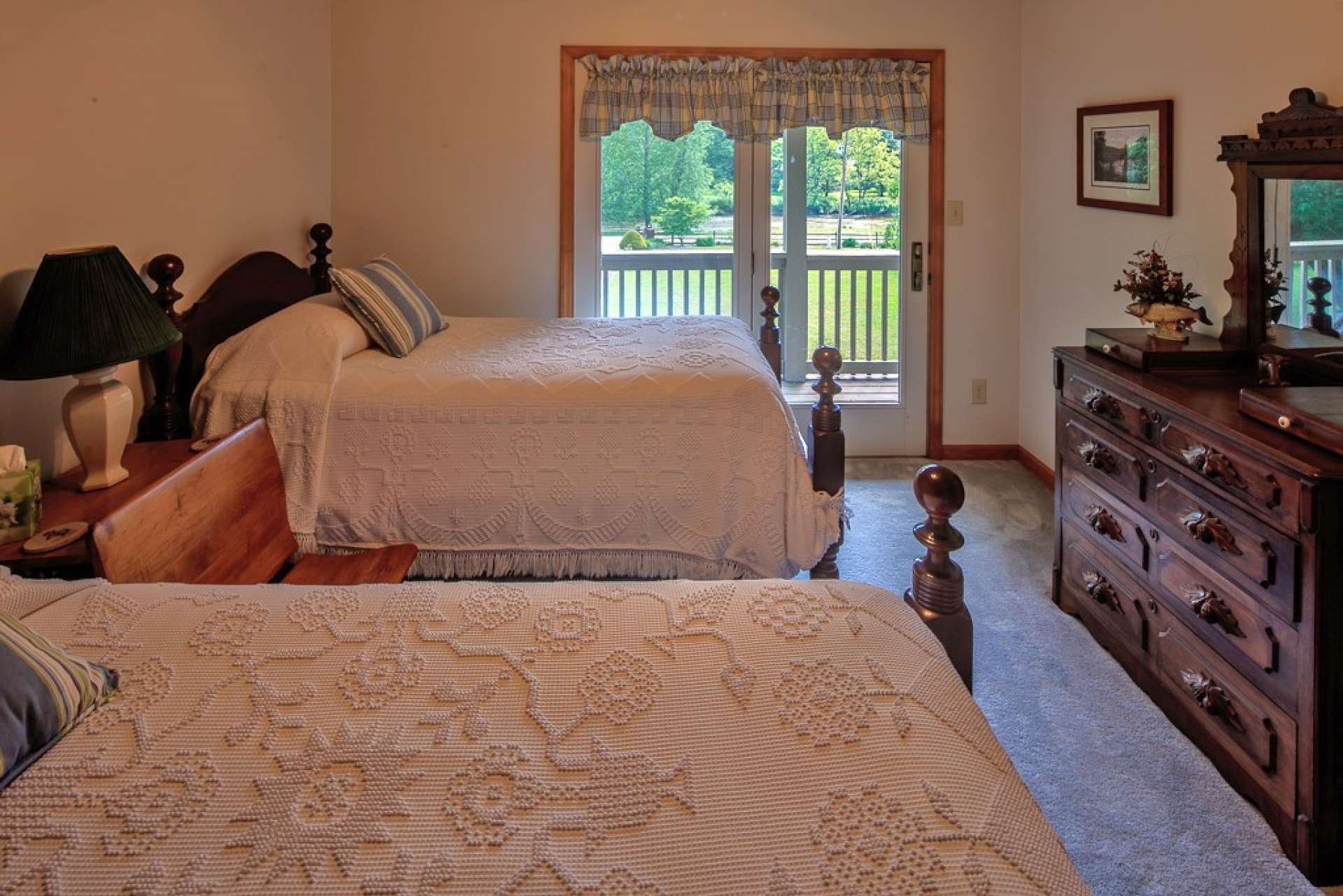 The third upper level bedroom features access to the upper level covered balcony.