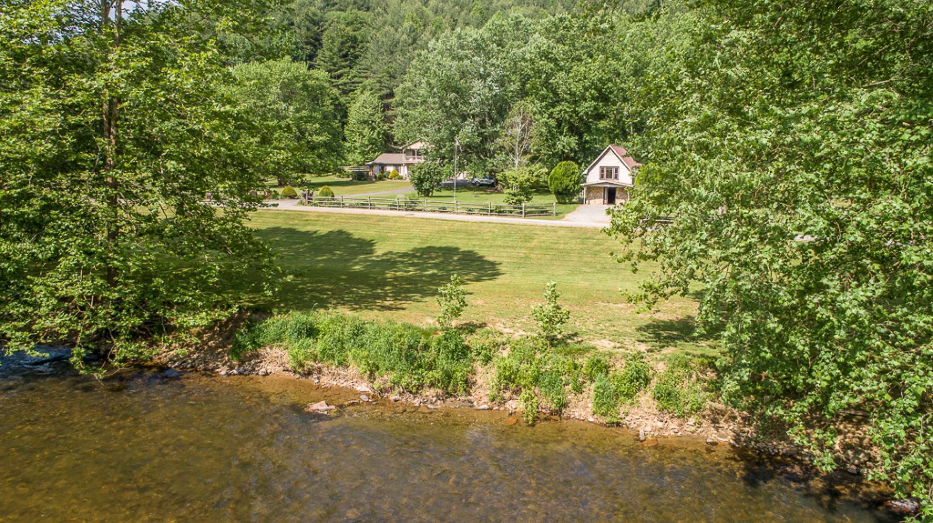 WELCOME HOME to your riverfront estate or retreat in Ashe County, NC. Just too many attributes to mention. Come tour this favored mountain riverfront estate with potential for a summer retreat, primary riverfront estate, equestrian estate, farm or Mountain vineyard. Call today for your appointment to view this gorgeous riverfront property offered at $750,000. P105