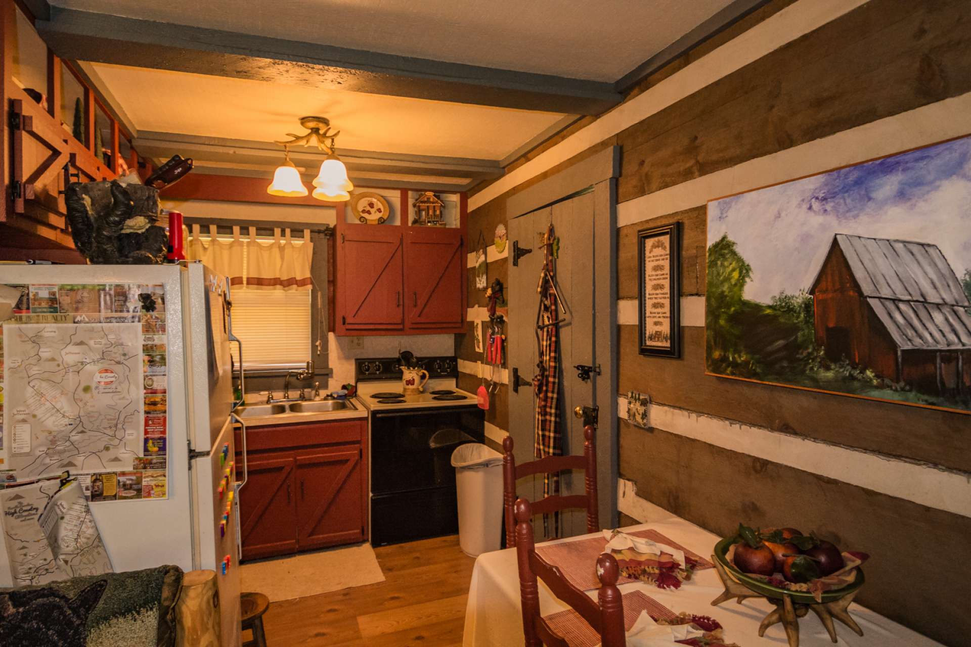 This charming kitchen and dining area is amply appointed  and efficient for those weekend meals.