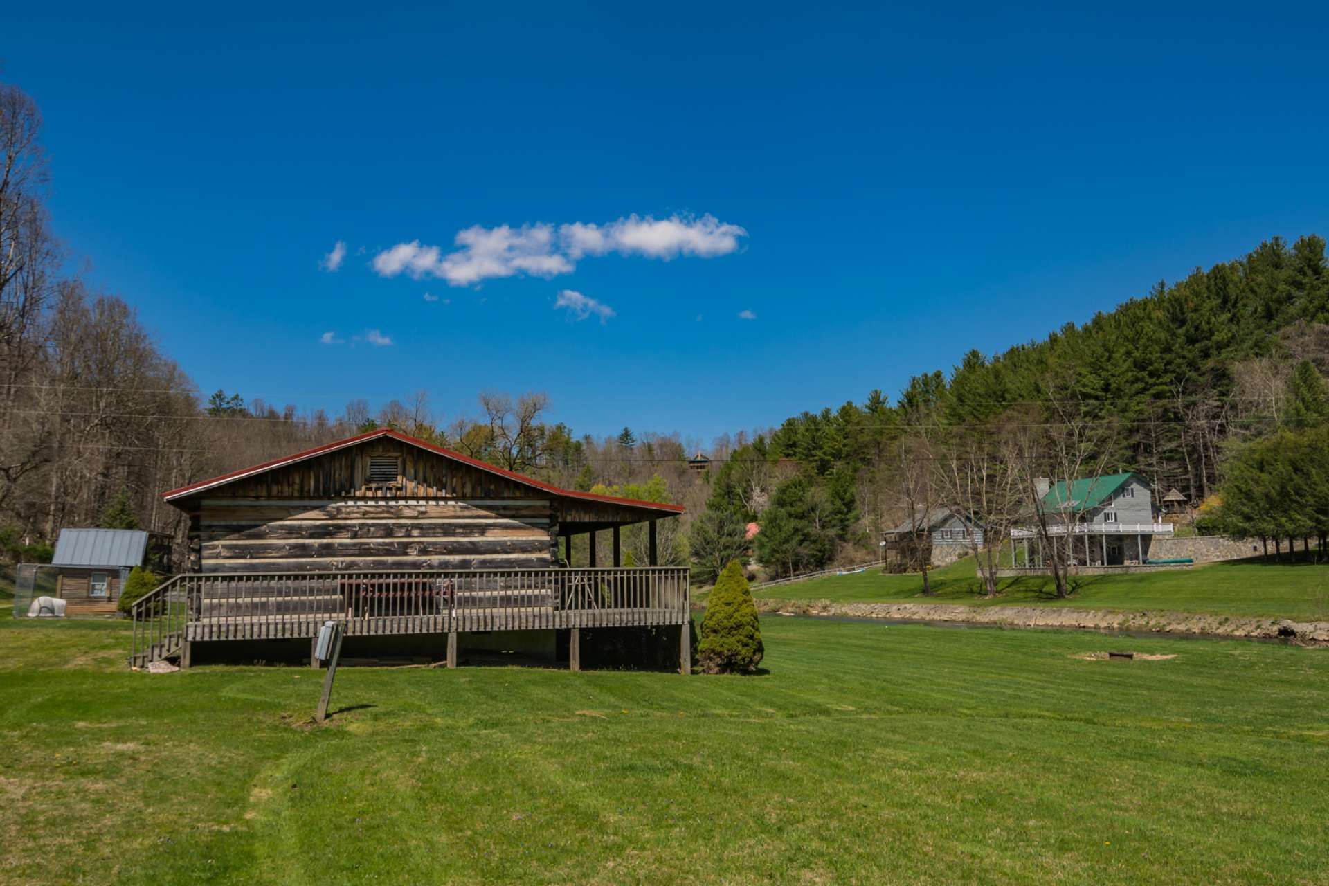 The large level yard space is perfect for outdoor gatherings and entertaining. There is an outbuilding that is perfect for lawn equipment and your river toys.