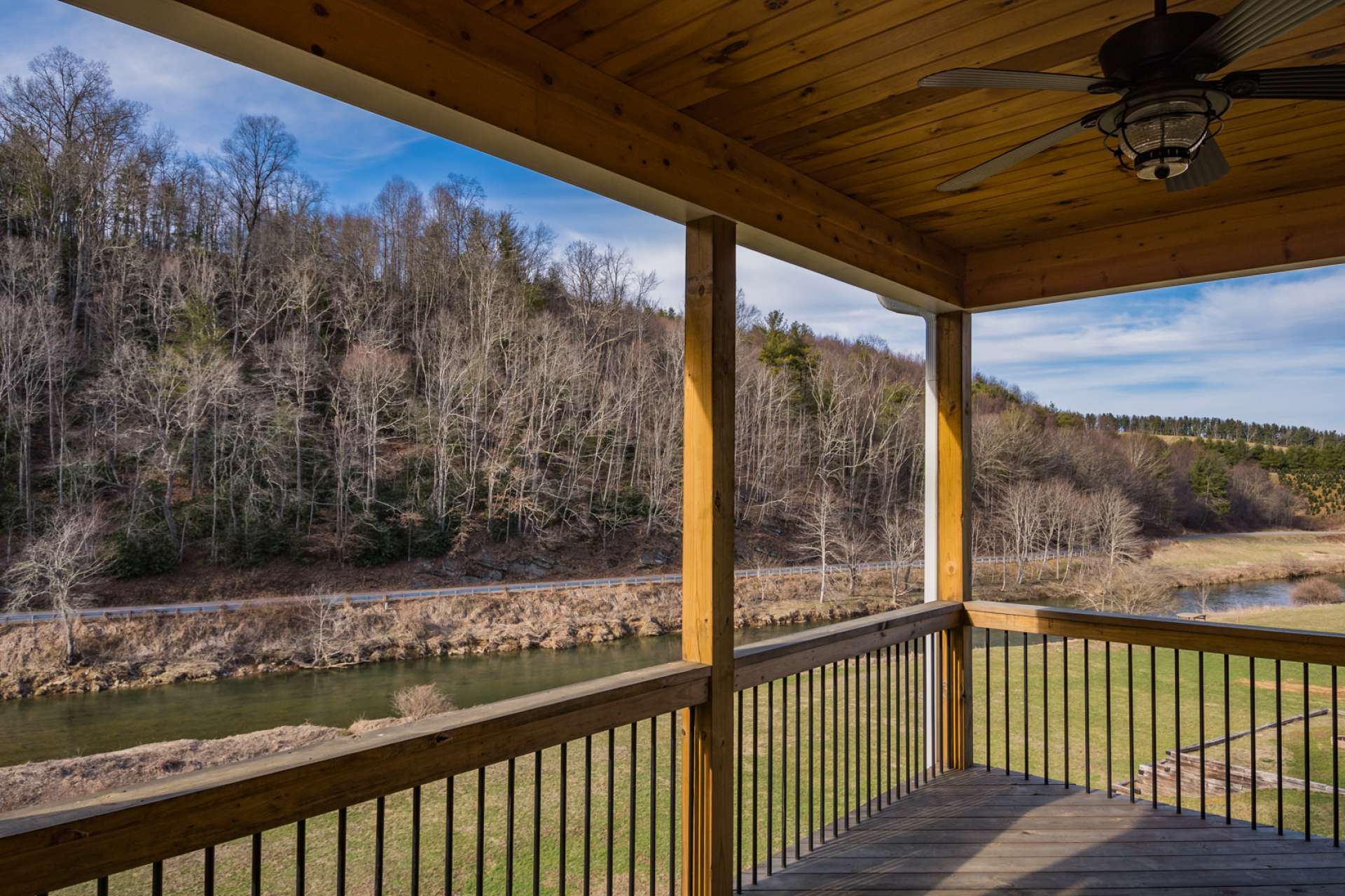 Double decks off of each level offer abundant outdoor space for entertaining, alfresco dining, or admiring your rushing river below.