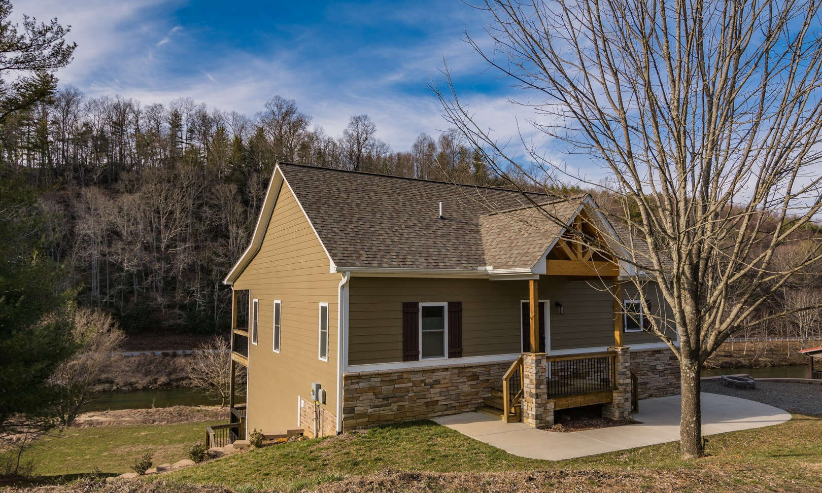Mountain Craftsman Riverfront Home! Conveniently located between Boone and West Jefferson on a 2.25 acre setting in the well established community of Green Meadow Estates, this beautiful custom-built 3-bedroom, 2.5-bath "Southern Living" home offers many key features not to be missed.