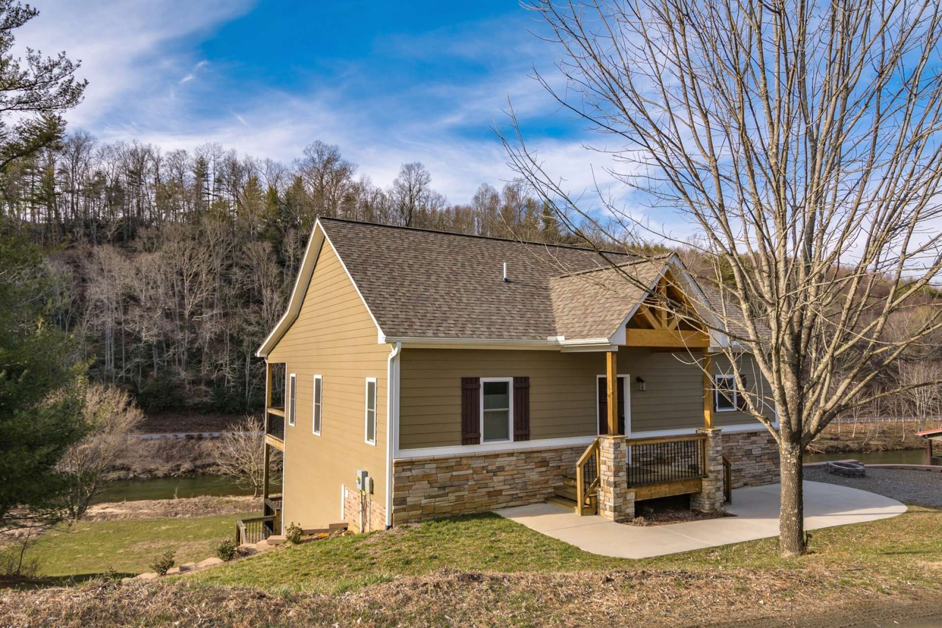 <b>Offered at $349,900, this exciting Craftsman style home on the banks of the New River in the Todd area of Southern Ashe County is the ideal solution for your NC Mountain home or high country retreat. Call today for additional information on listing S174.  *Also offered with an additional lot for a total of 2.25 acres for $445,000</b>