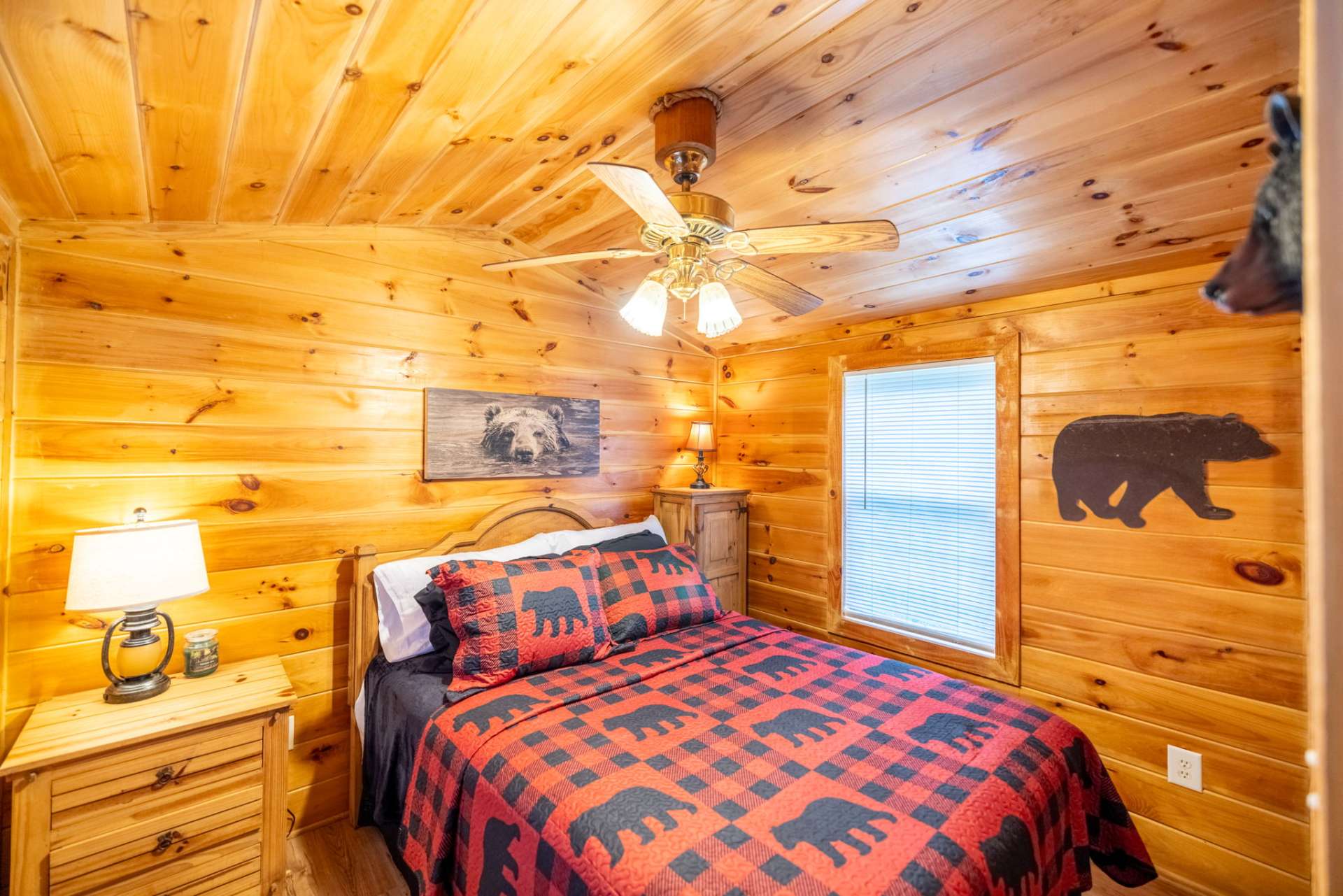 A comfy bedroom with a wall air conditioner in cabin 2