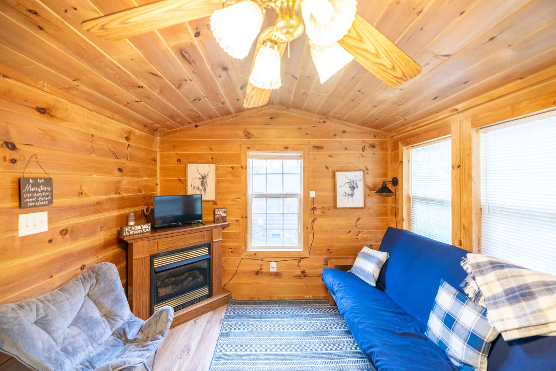 The abundance of windows in the open living, dining, and kitchen brings in sunlight and the opportunity to open the windows and enjoy the mountain breeze