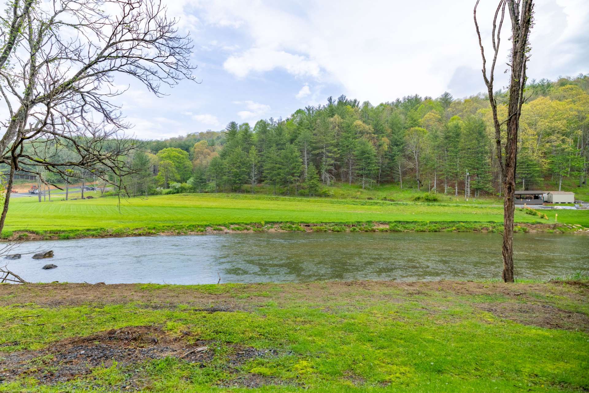 You will own 2 cabins on the river and an additional riverfront lot for future expansion