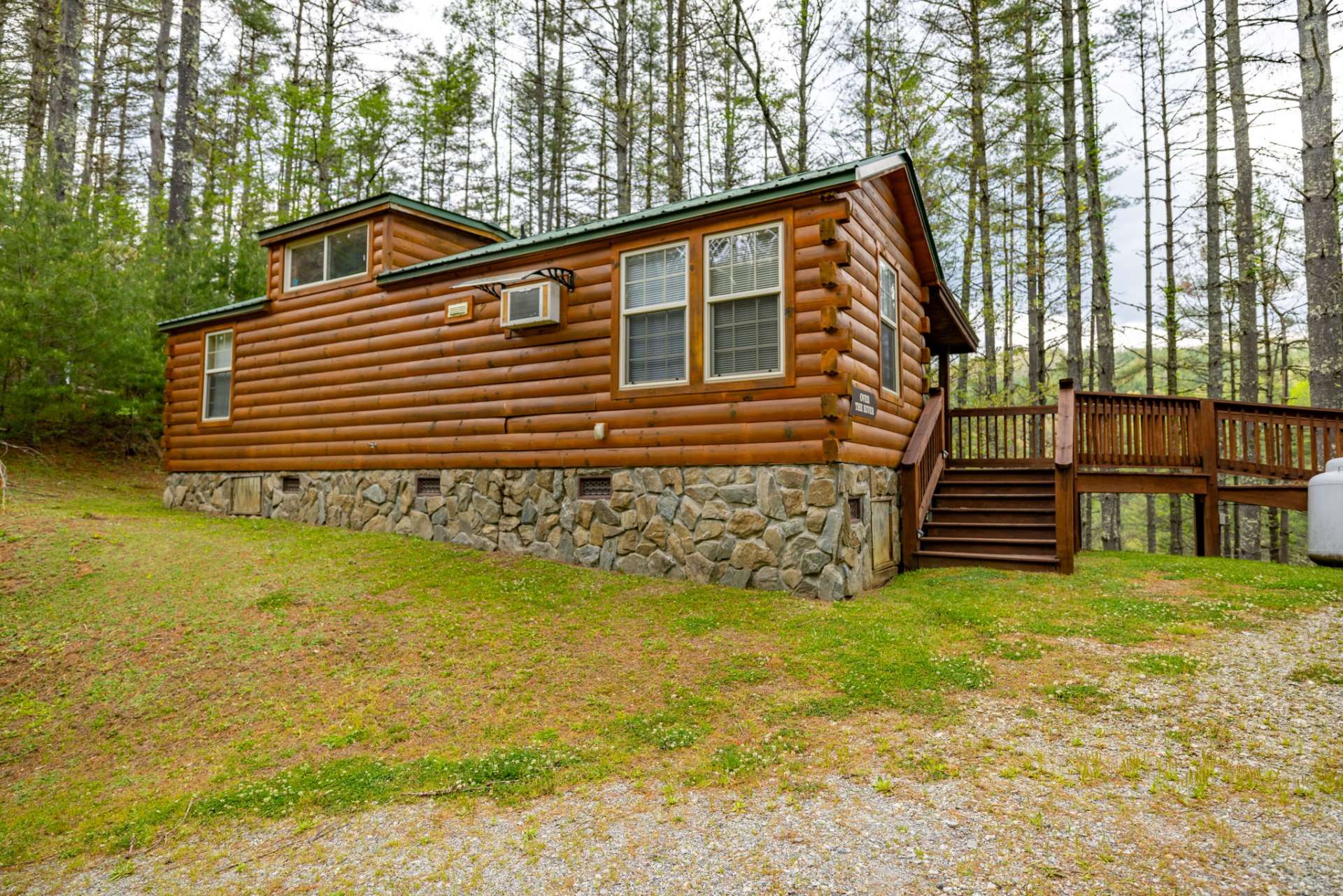 The rustic cabin that is so popular with a beautiful rock foundation