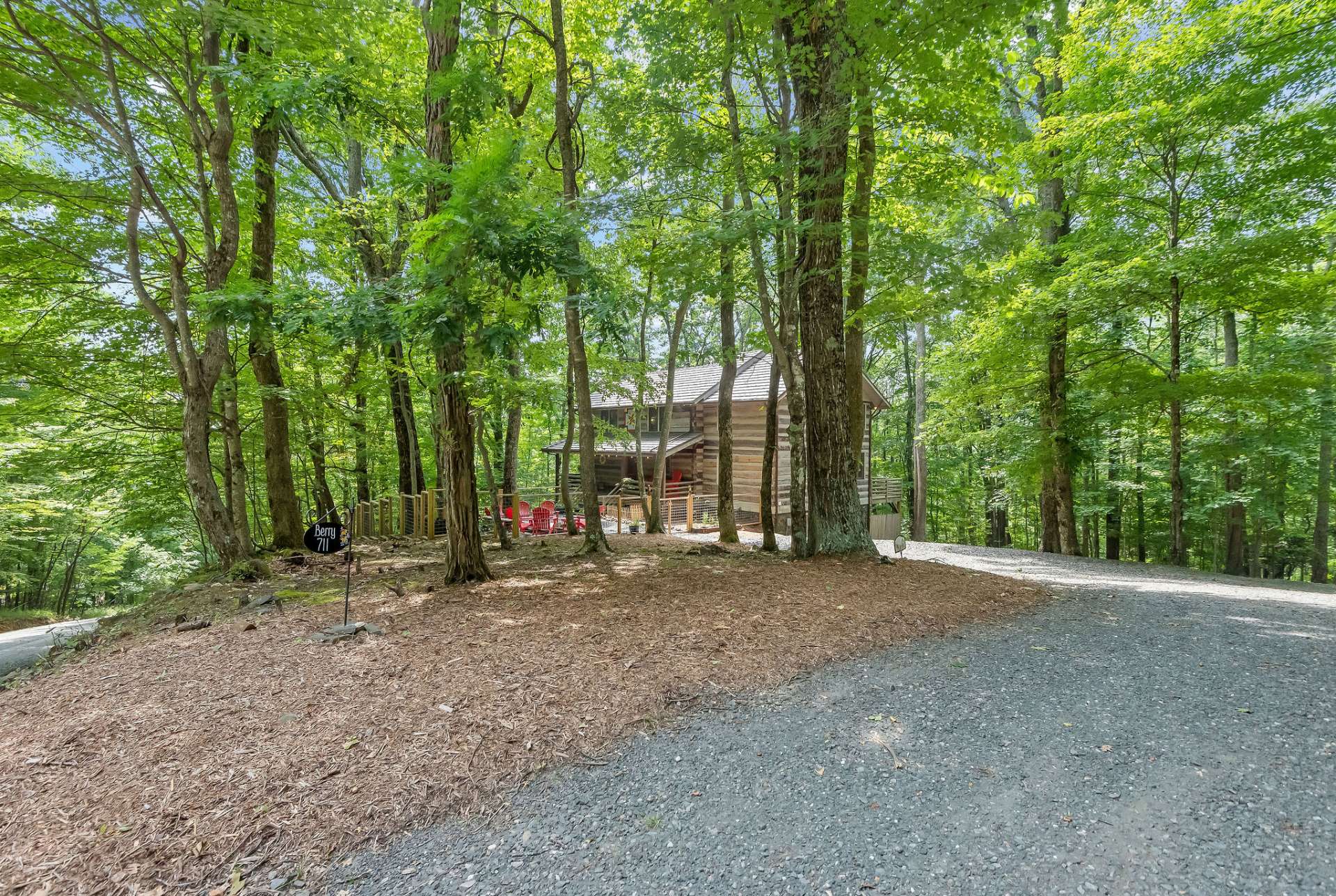 A stone driveway leads you to your cabin in the woods.