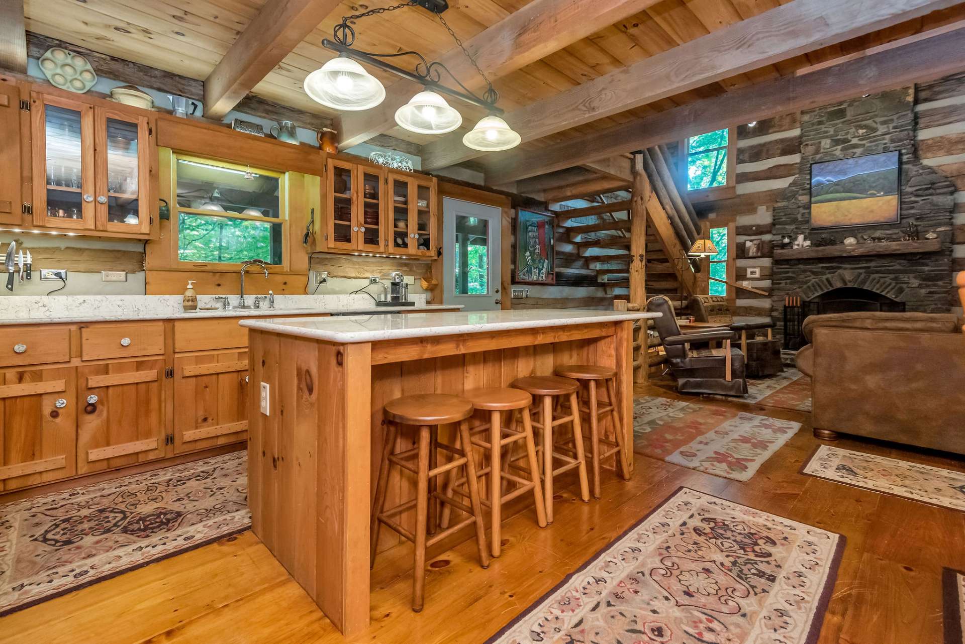 The large kitchen island will serve you well with additional counter space for creating and serving, extra seating, and informal dining.