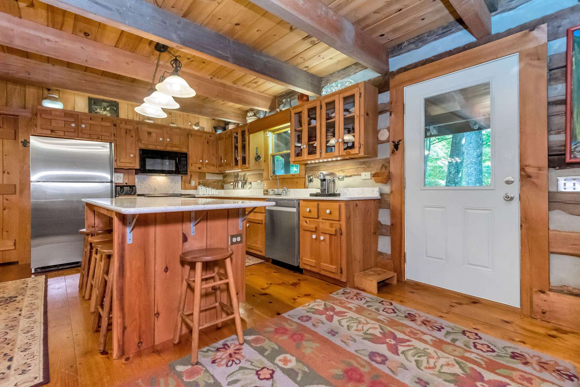 Modern kitchen featuring granite counter tops and stainless appliances.