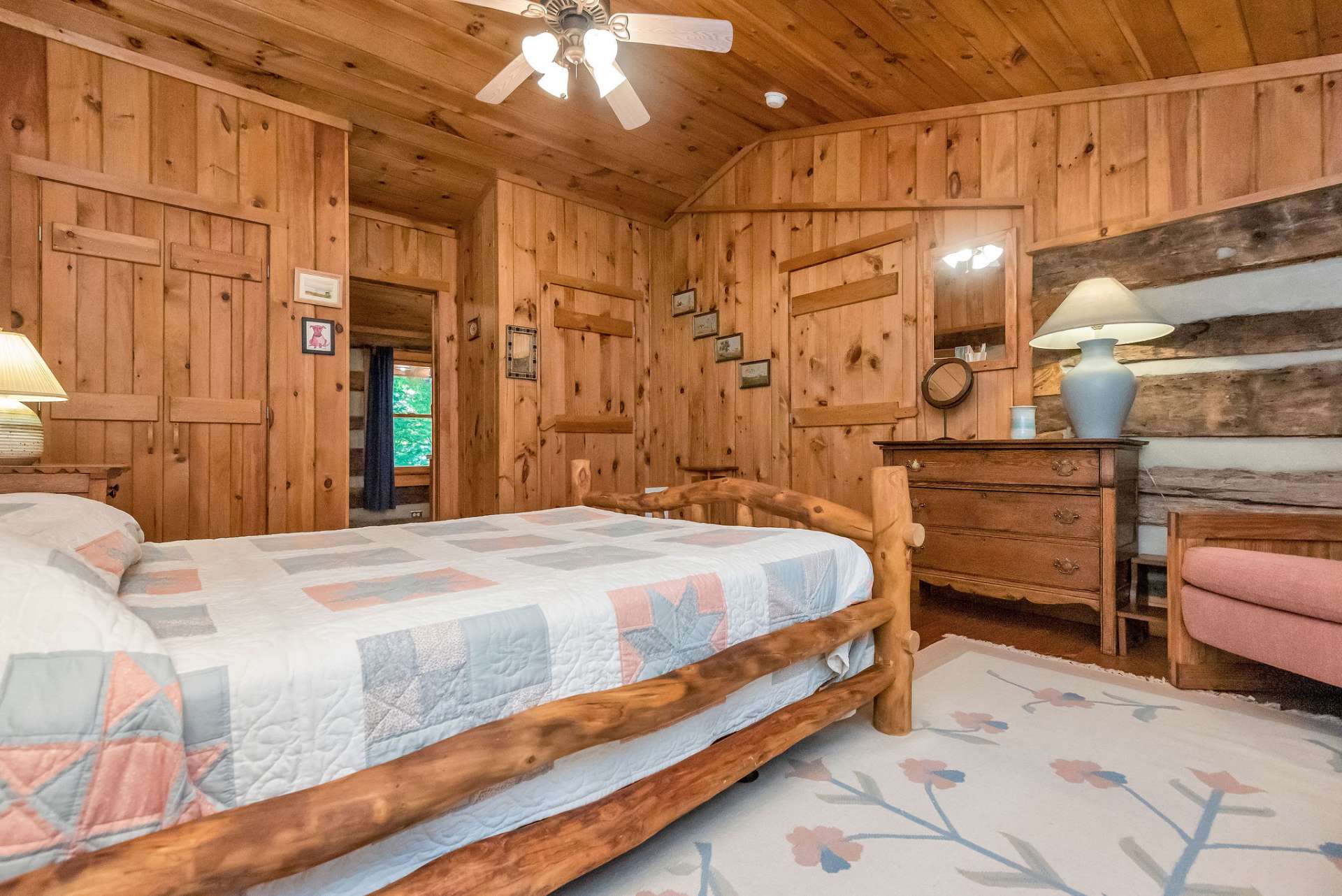 The guest room features vaulted ceilings, double closets, and an entry to the loft bath.