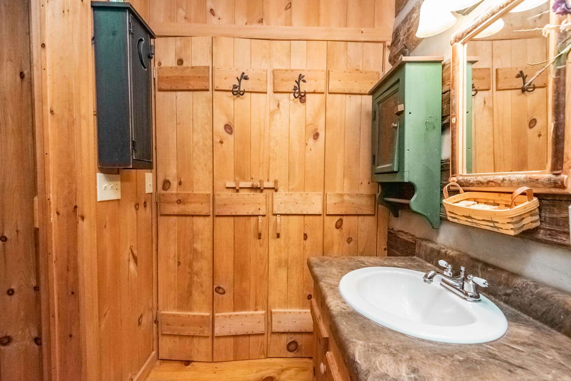 Laundry closet is located in this bathroom for convenience.
