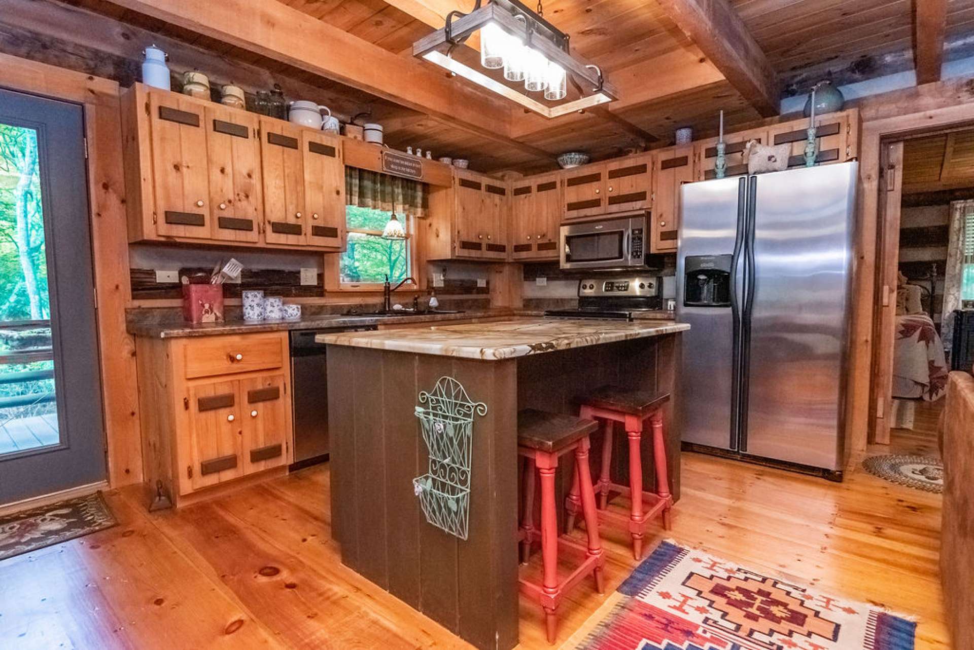 Kitchen island provides additional storage and seating. Great for intimate dinners or playing games after dark.