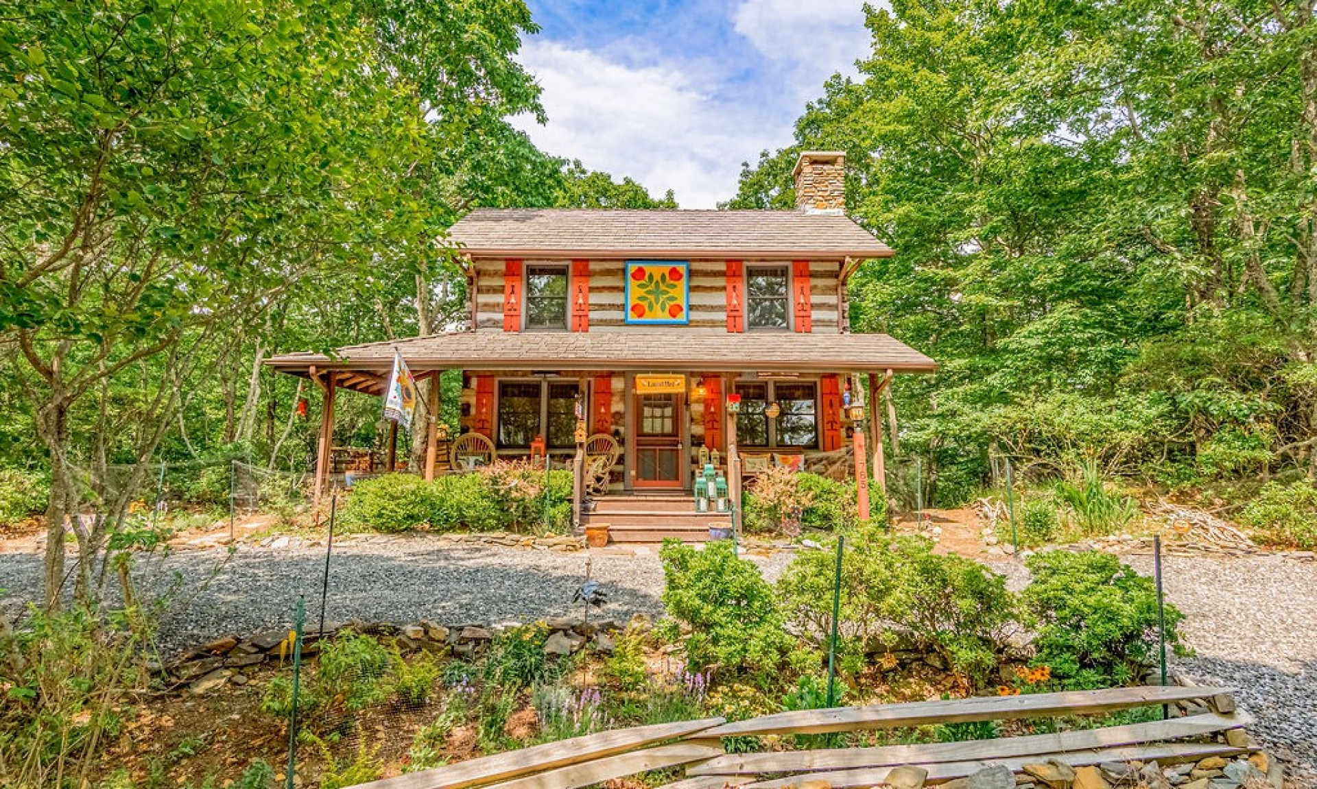 This antique log cabin glows with charm!