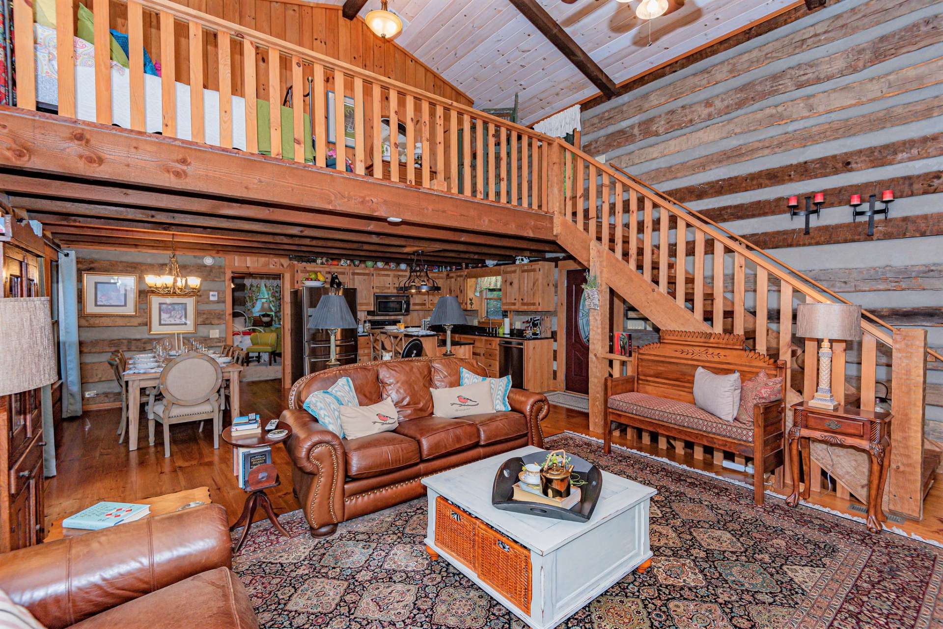 Back to the living area and head up the hand hewn stairs leading to the upper guest quarters.