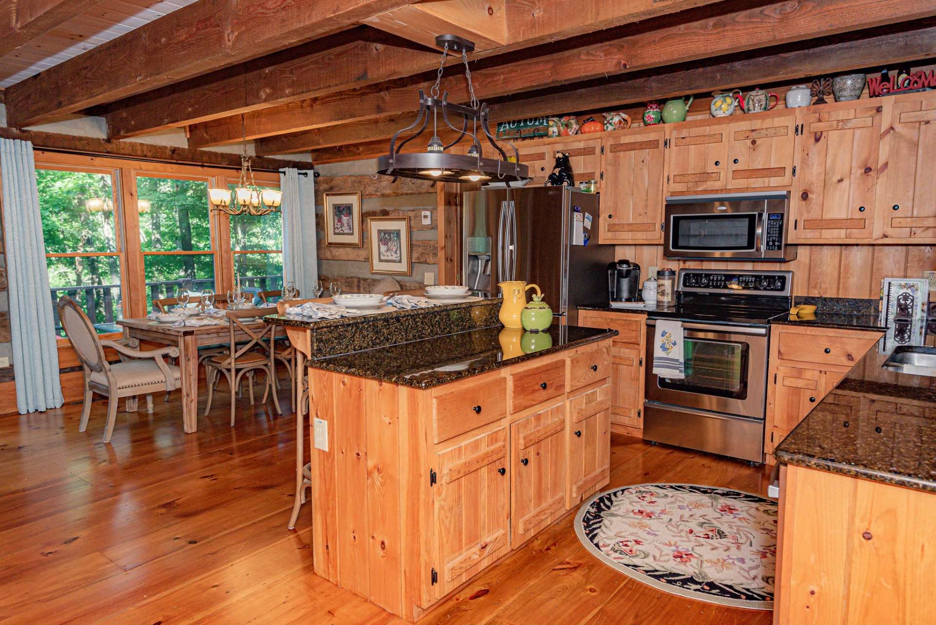 The dining area is bright and has views and access to the back deck.