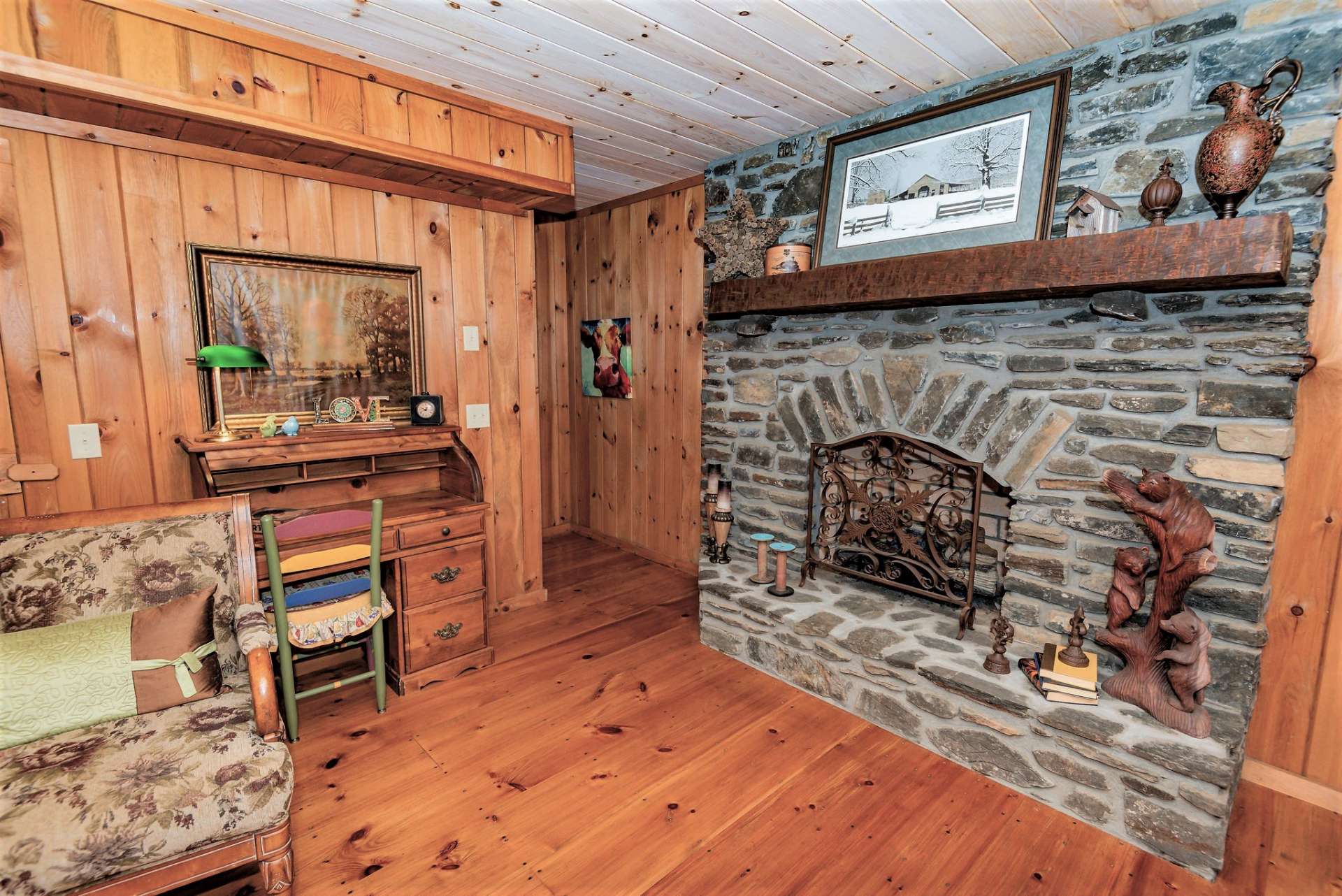 The second stone fireplace with gas logs is located on the lower level and enhances the log cabin feel while adding warmth on cool winter evenings.