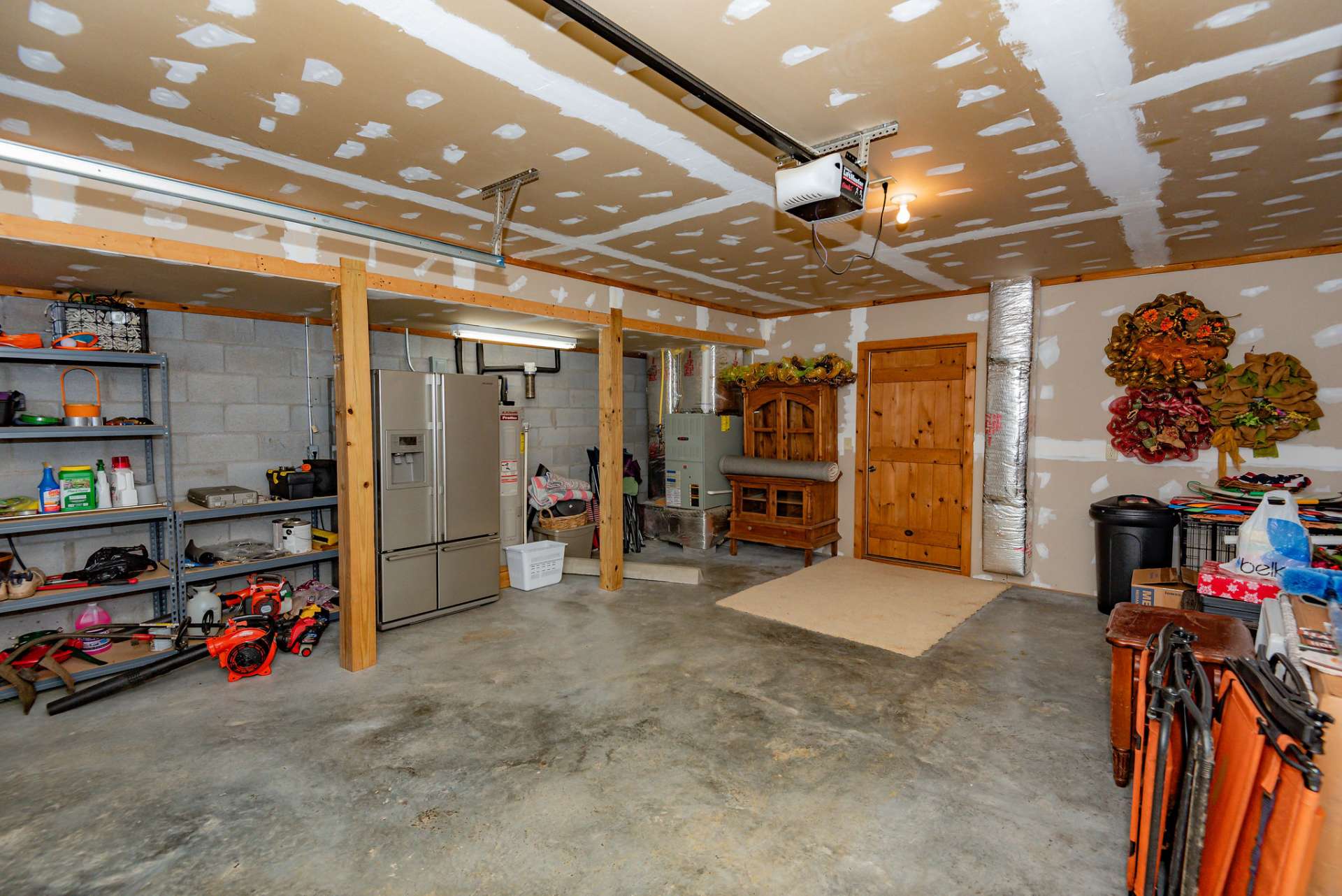 Convenient access to oversized one car garage offering abundant storage space is also on the lower level.