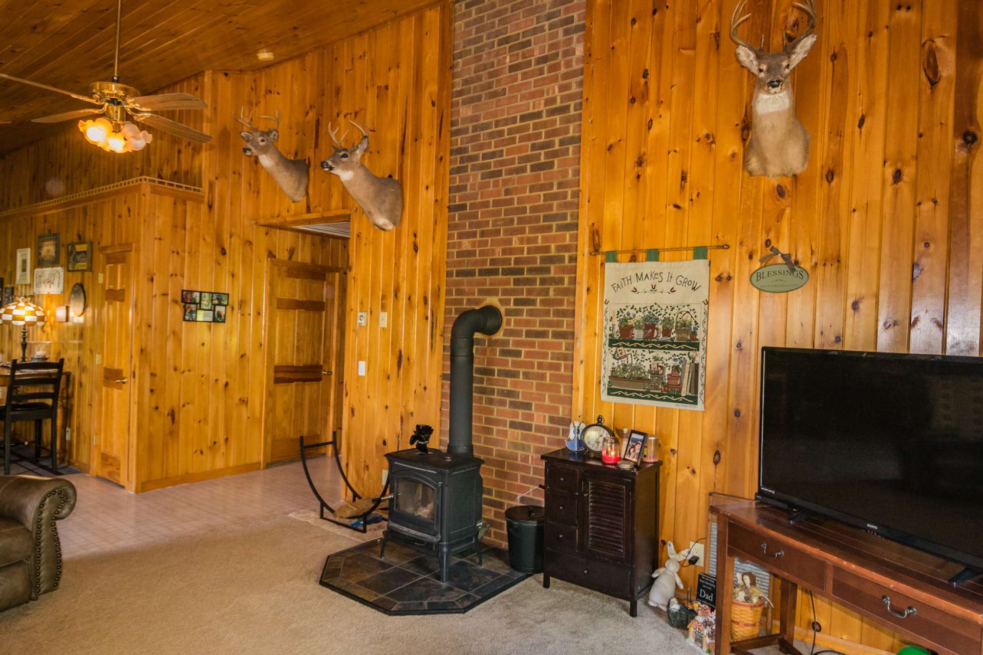 A wood -burning stove adds warmth and ambiance to the space.